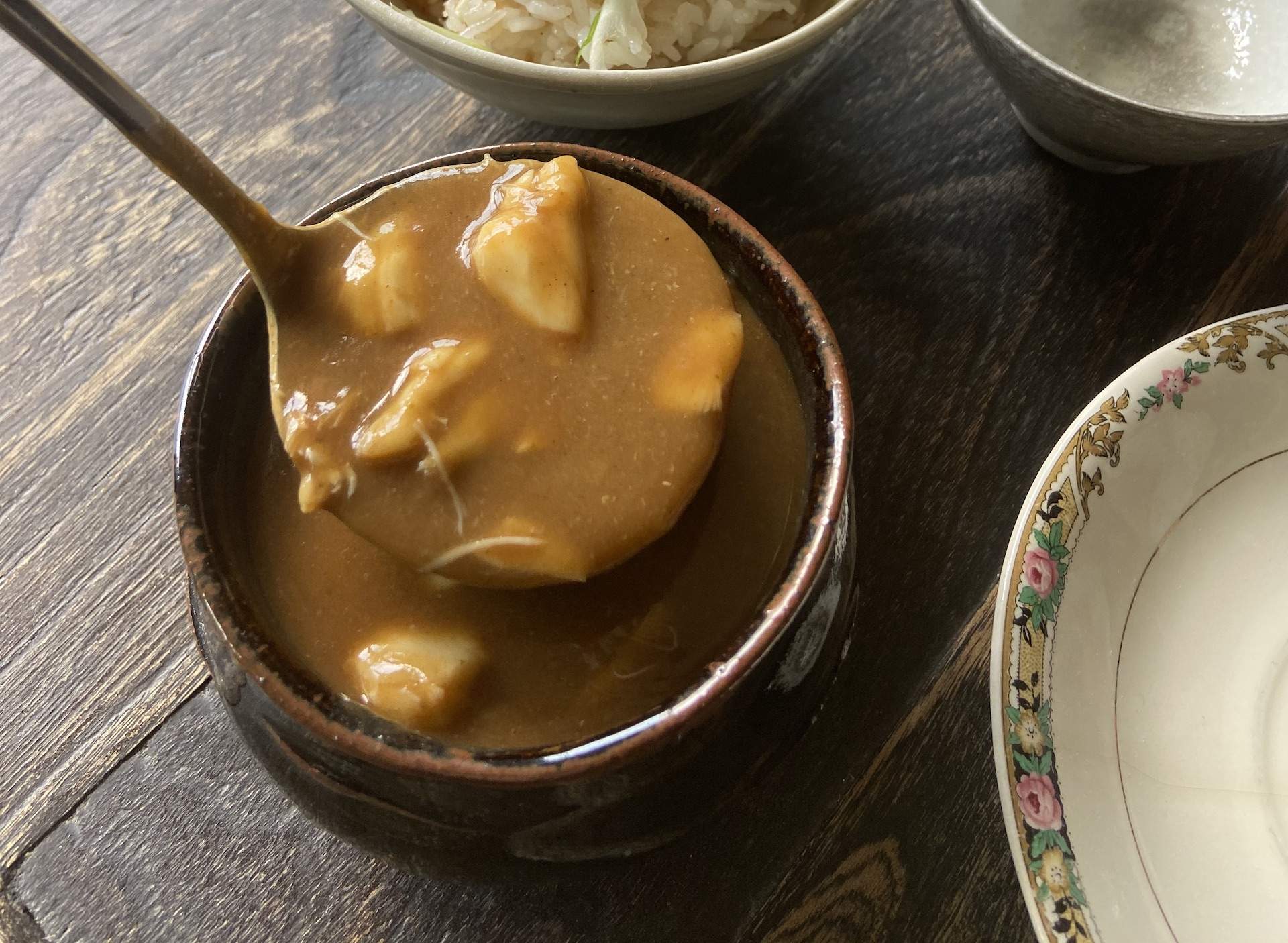 A yellowish-brown crab gravy at the Chicago restaurant Split-Rail