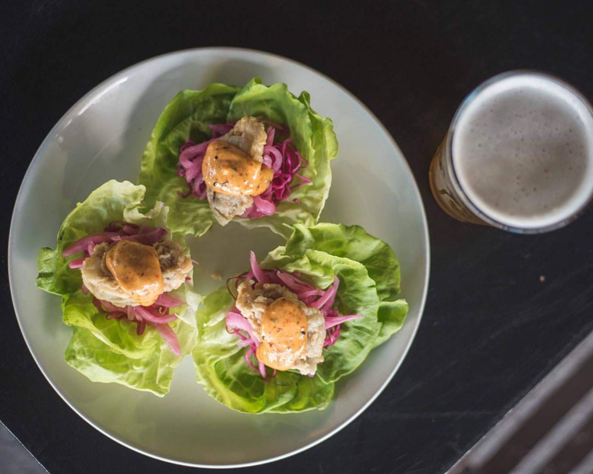 oysters with an orange sauce and pickled red onions at Row 34 in Cambridge