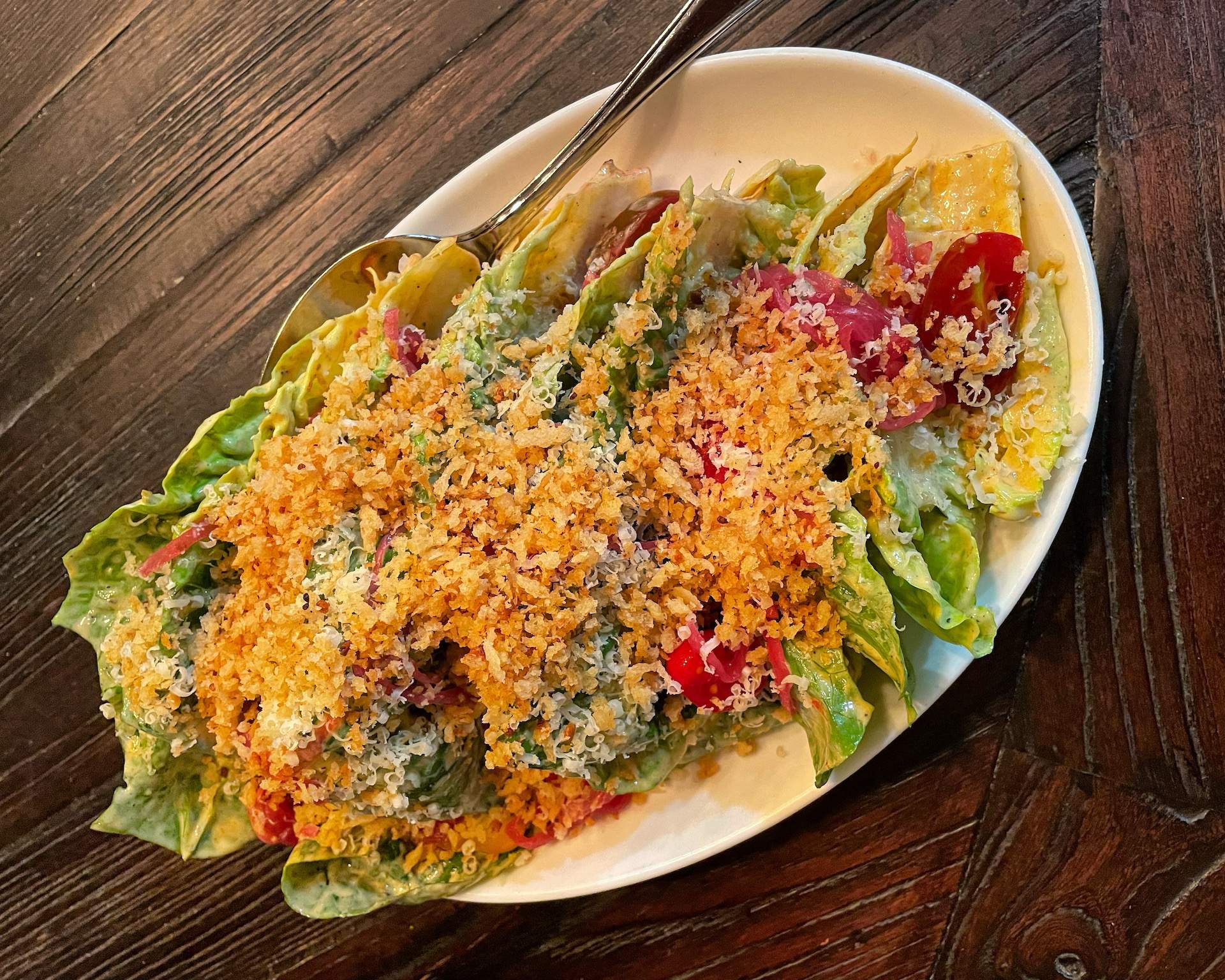 A caesar salad at Chicago restaurant Split-Rail