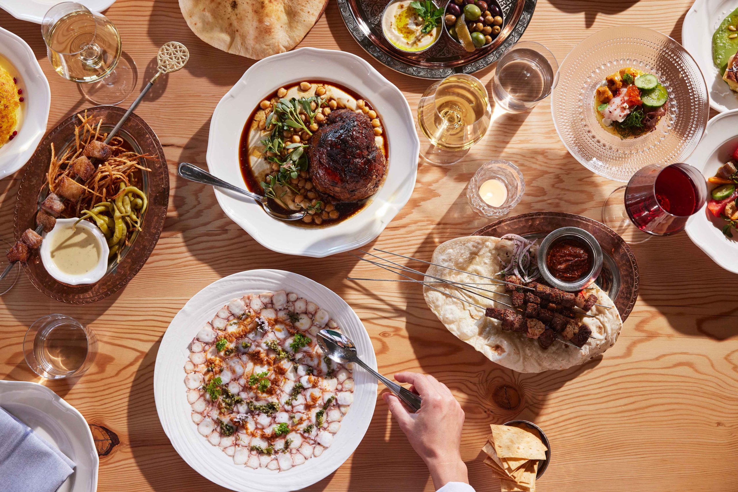 A Middle Eastern feast featuring lamb shoulder, kebabs, and octopus at Dalida in San Francisco