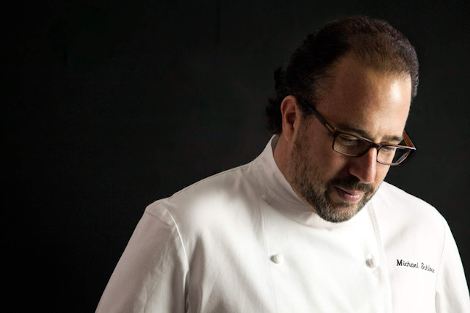 The chef and restaurateur Michael Schlow in a white chef's apron