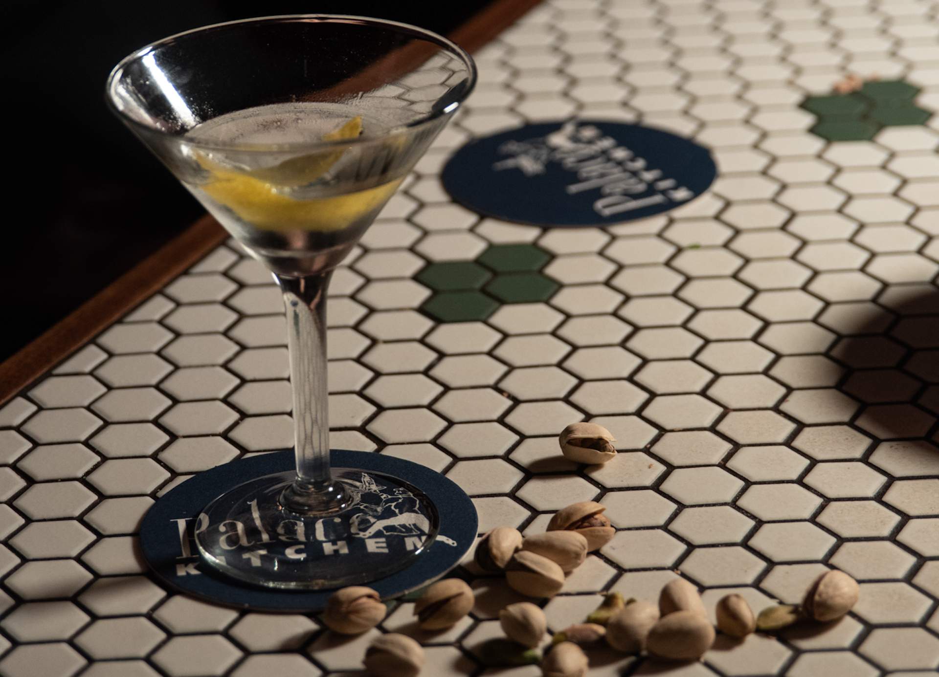 A cocktail on a tiled surface at Seattle restaurant Palace Kitchen.
