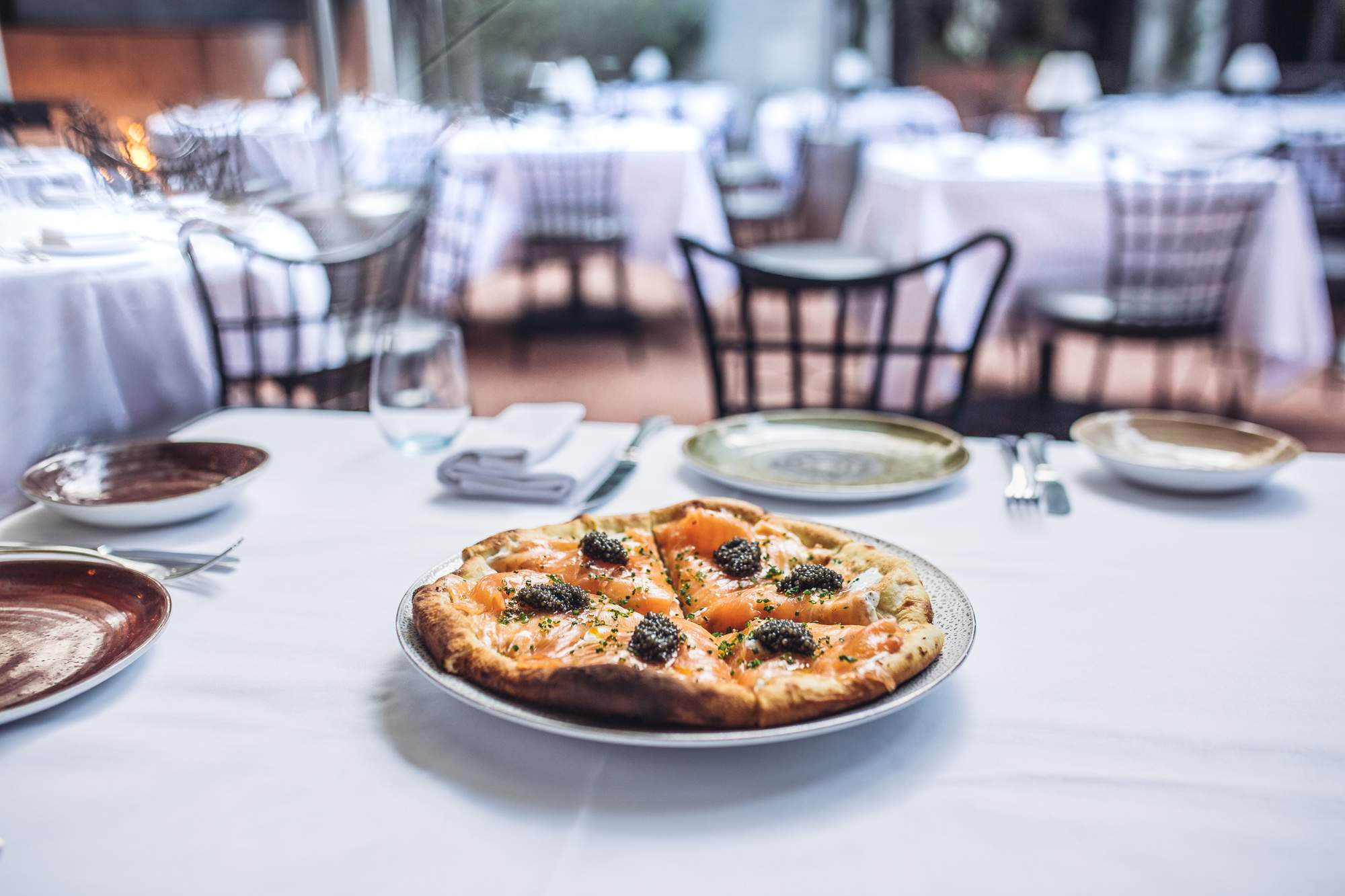 Smoked salmon pizza with crème fraîche and caviar at Spago in Los Angeles
