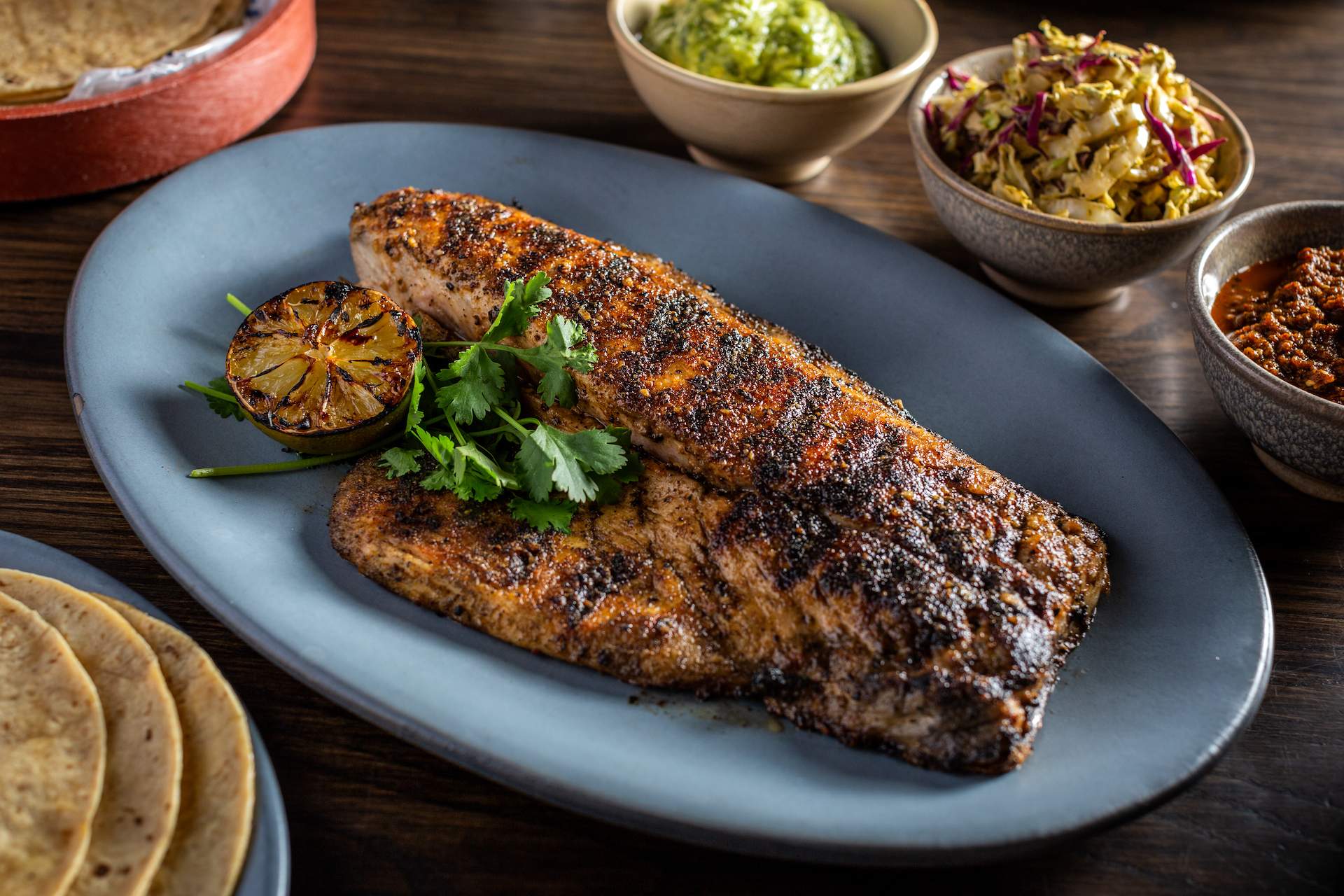 Grilled whole fish that becomes part of tacos at Chicago restaurant The Dawson.