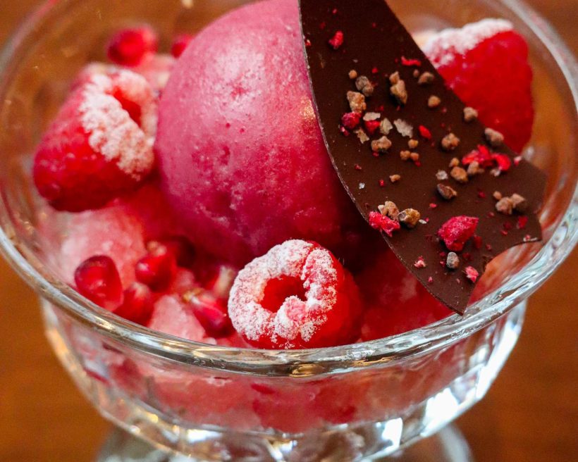 A pink sorbet dessert at Nashville restaurant Yolan