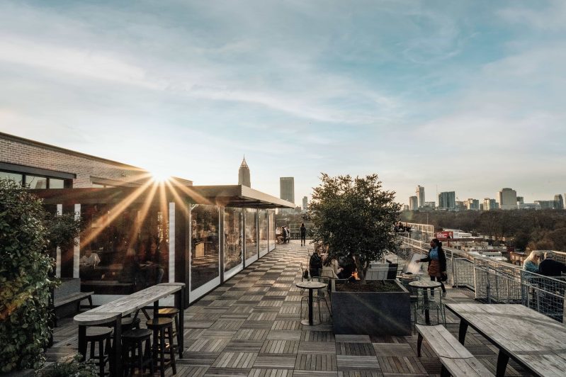 Sunlight hits 9 Mile Station, an airy rooftop beer garden on top of Ponce City Market in Atlanta.
