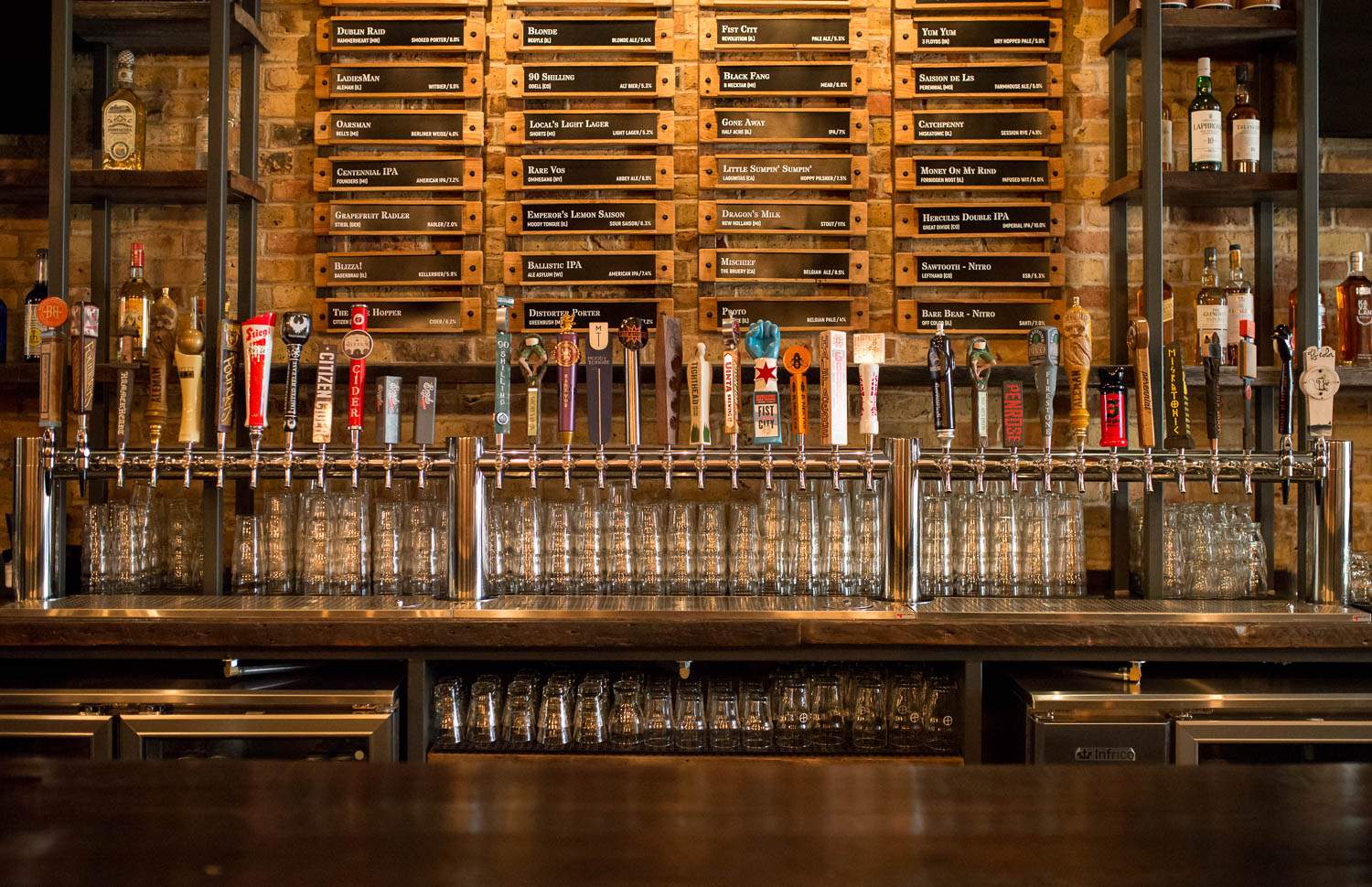 A row of beers on tap at Centennial Crafted Beer & Eatery in Chicago