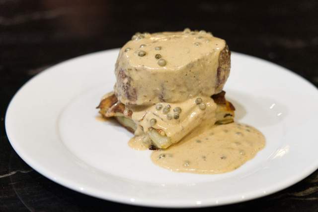 Filet mignon with a green peppercorn sauce and potatoes at LA Italian restaurant Dal Milanese.