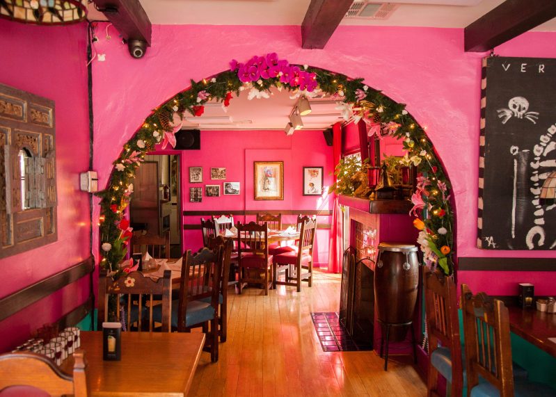 A pink archway leading to a second room in the Los Angeles Mexican restaurant Casita del Campo. Photo credit: Three Fold Agency/Leo Deveney