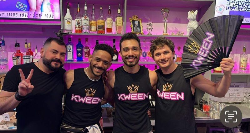 Four staff members of the NYC LGBTQ bar Kween standing next to each in black t-shirts that have the word “Kween” on it.