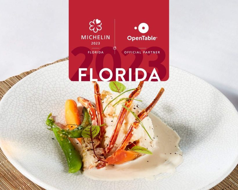 A logo for the MICHELIN bib gourmand restaurants in Florida featuring a red design on top and a plate with crab on it