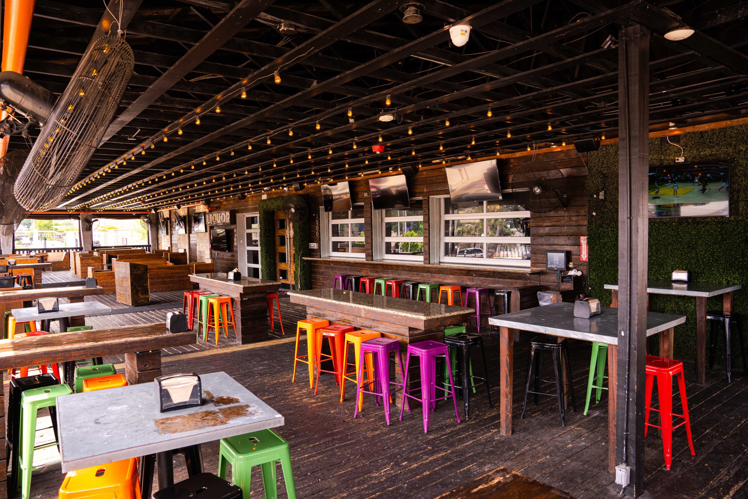 Brightly colored stools and Edison string lights at Prospect Park Galleria in Houston