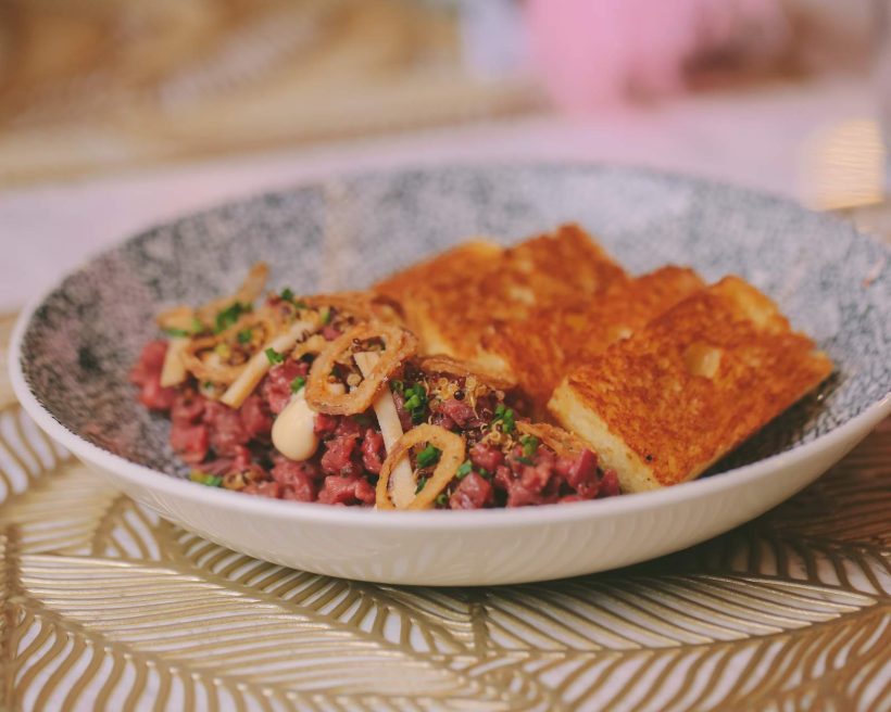 A plate of steak tartare with toast at Palm Springs restaurant Gigi’s.