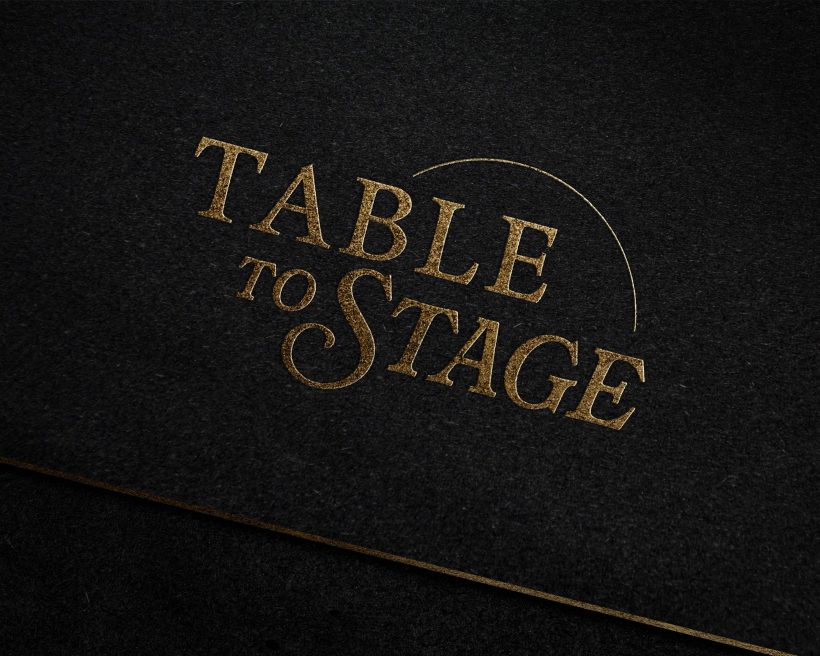 A black image reading "Table to Stage" in gold
