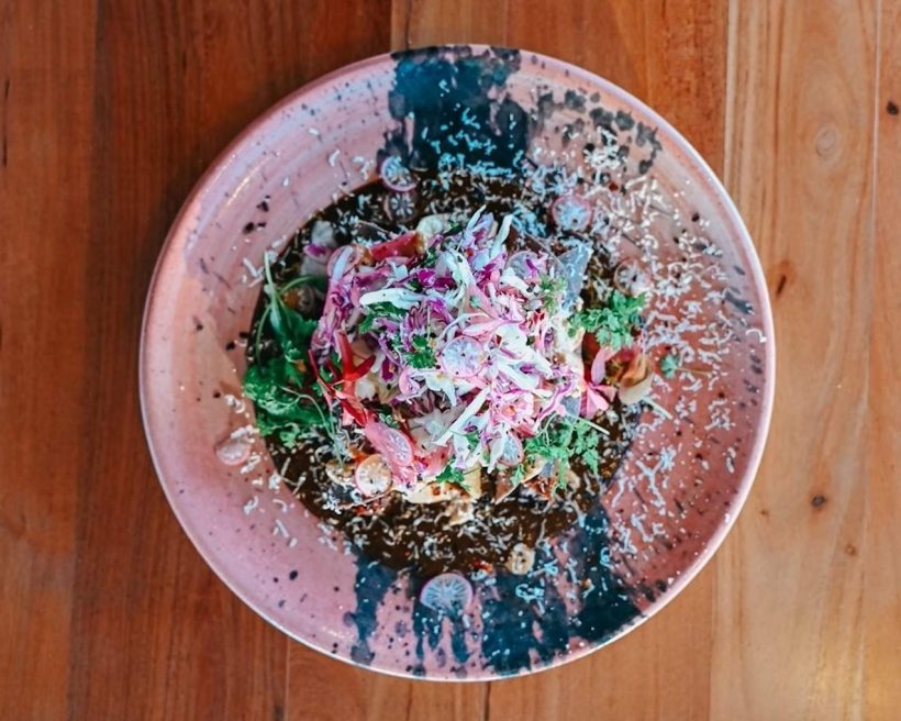 A mole dish with pickled onions and cabbage on top at Phoenix Mexican restaurant Chilte