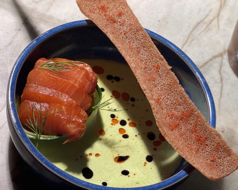 A salmon dish called Swediopian with a green sauce at NYC restaurant Hav & Mar