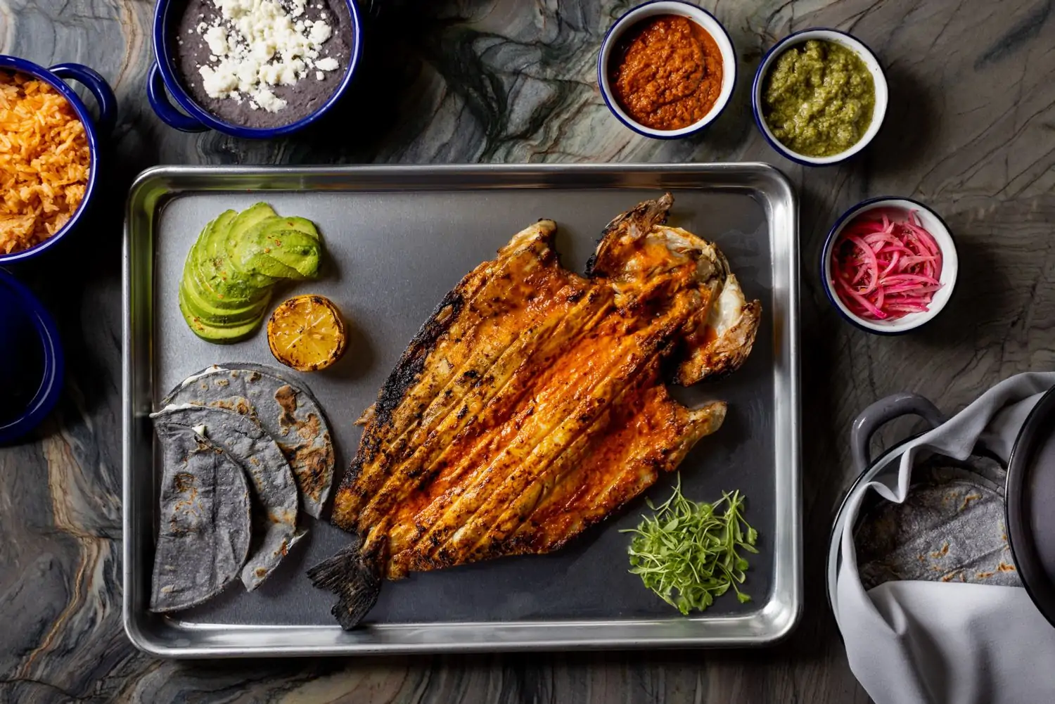Whole grilled branzino at Loreto, one of the best patio restaurants in Los Angeles. Book on OpenTable.