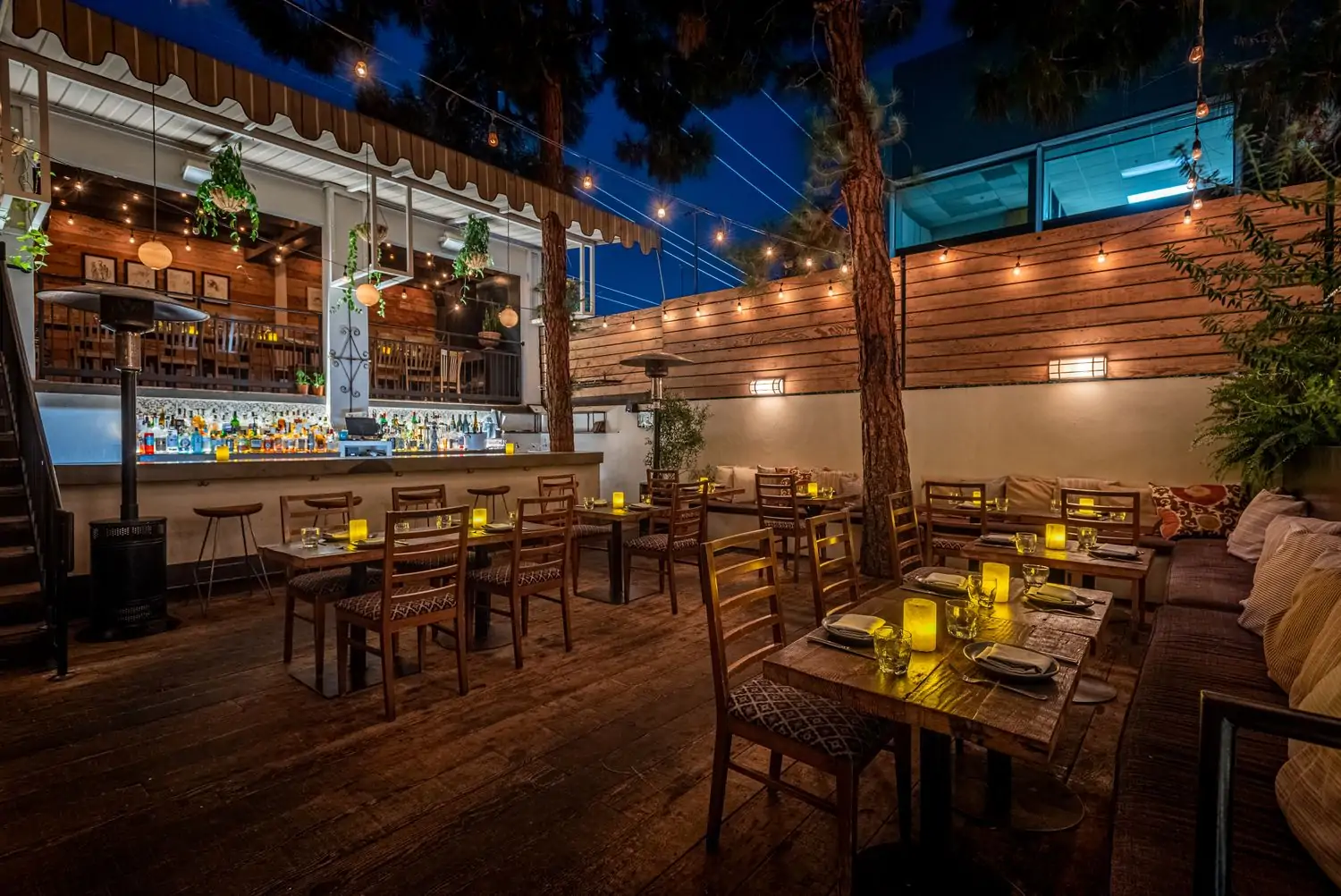 Fia’s patio, one of OpenTable’s best outdoor restaurants in Los Angeles, has candlelit tables, a full bar, and private nooks.