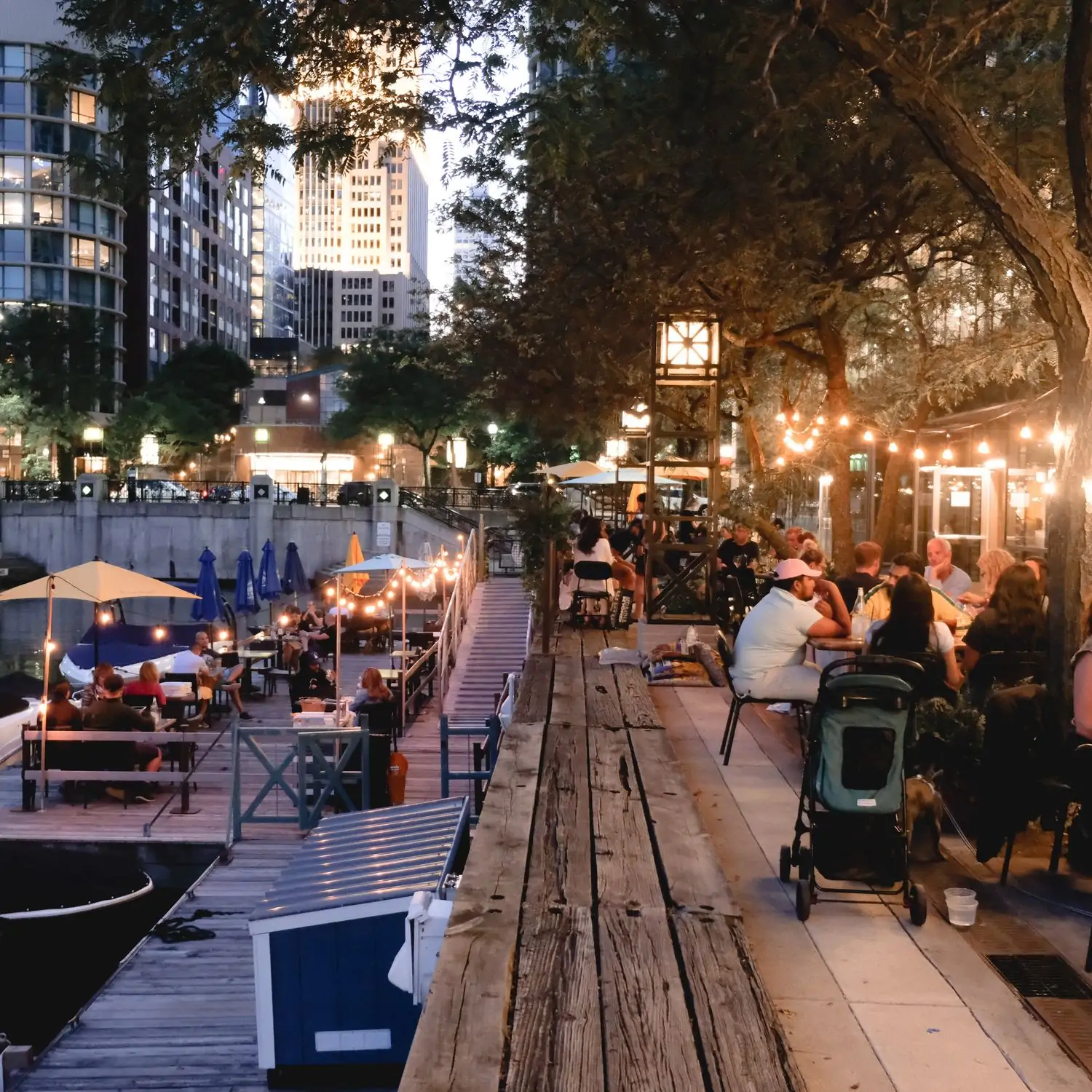 Hanging Edison bulbs and natural foliage create a gardenlike feel at Robert’s Pizza and Dough Company, a top pizza restaurant in one of the best Chicago outdoor dining spots on OpenTable.
