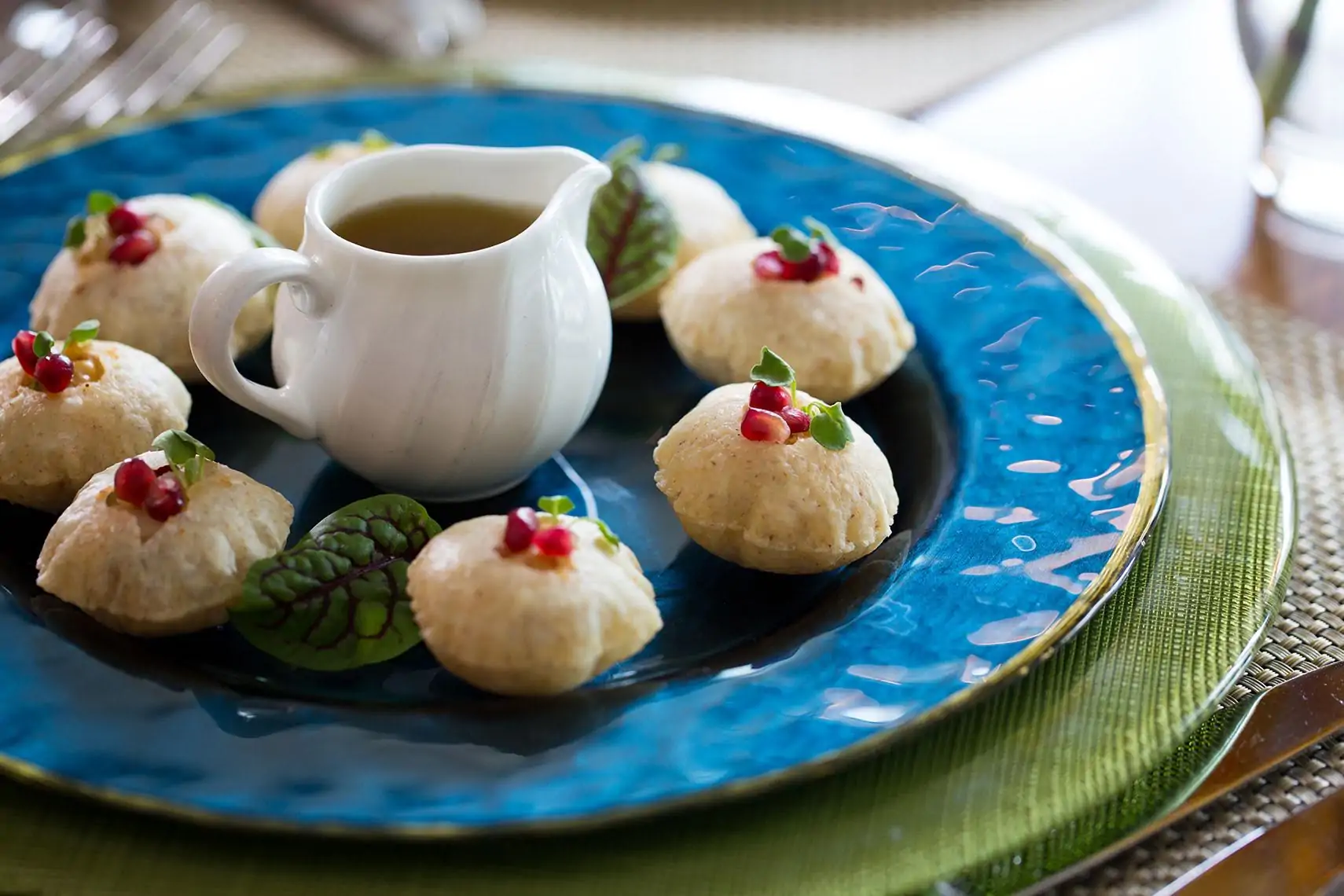 A plate of semolina and wheat flour puffs with potato, garbanzo beans, and mint-tamarind water at Kiran’s in Houston. Book on OpenTable.