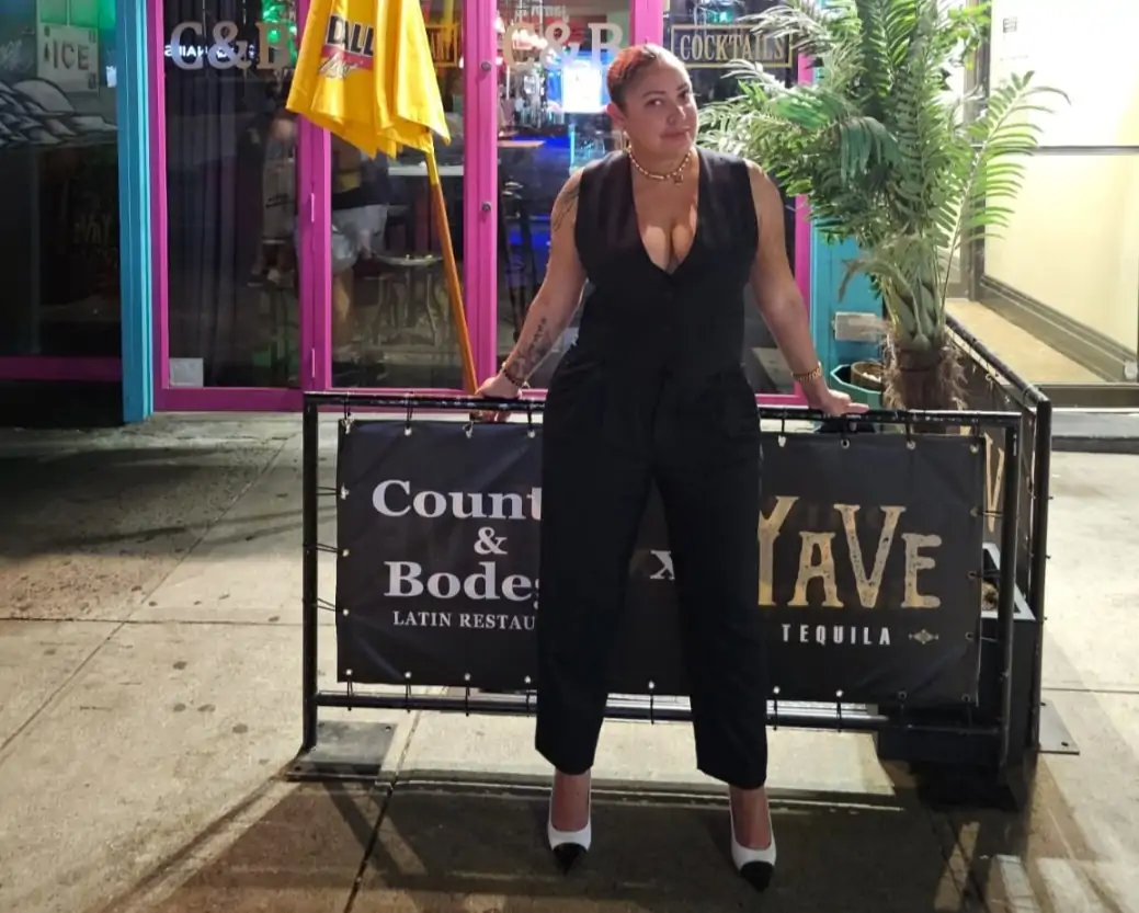 The owner of NYC restaurant Counter & Bodega standing in front of her Chelsea restaurant