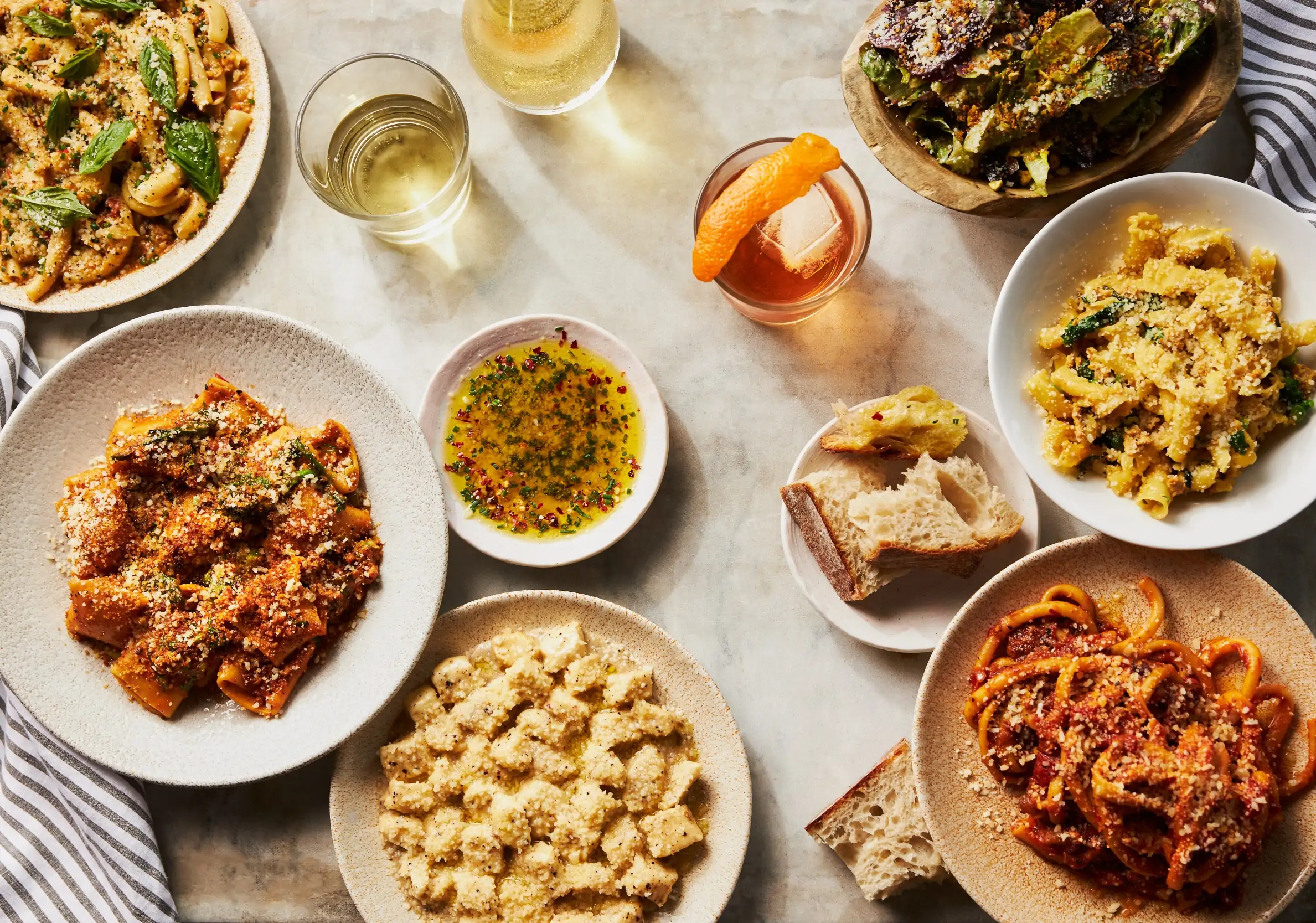 Cacio e pepe gnocchi, bucatini all amatriciana, and other plates of pasta at MIDA, one of the fancy restaurants in Boston. Book on OpenTable.