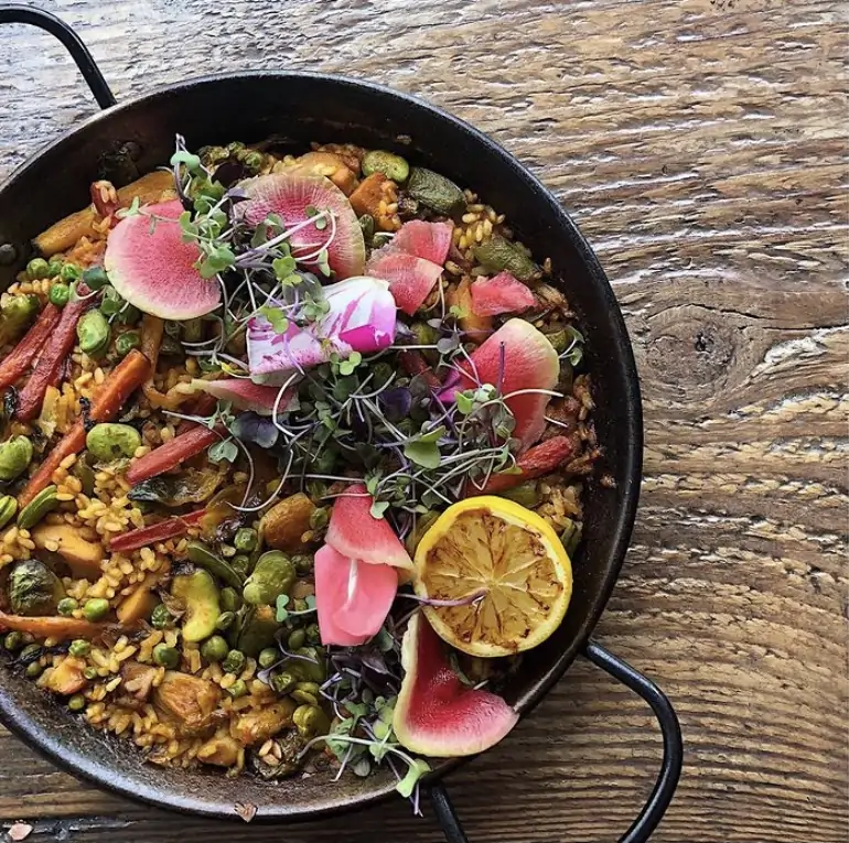 A paella with thinly sliced radish at Los Angeles restaurant Gasolina