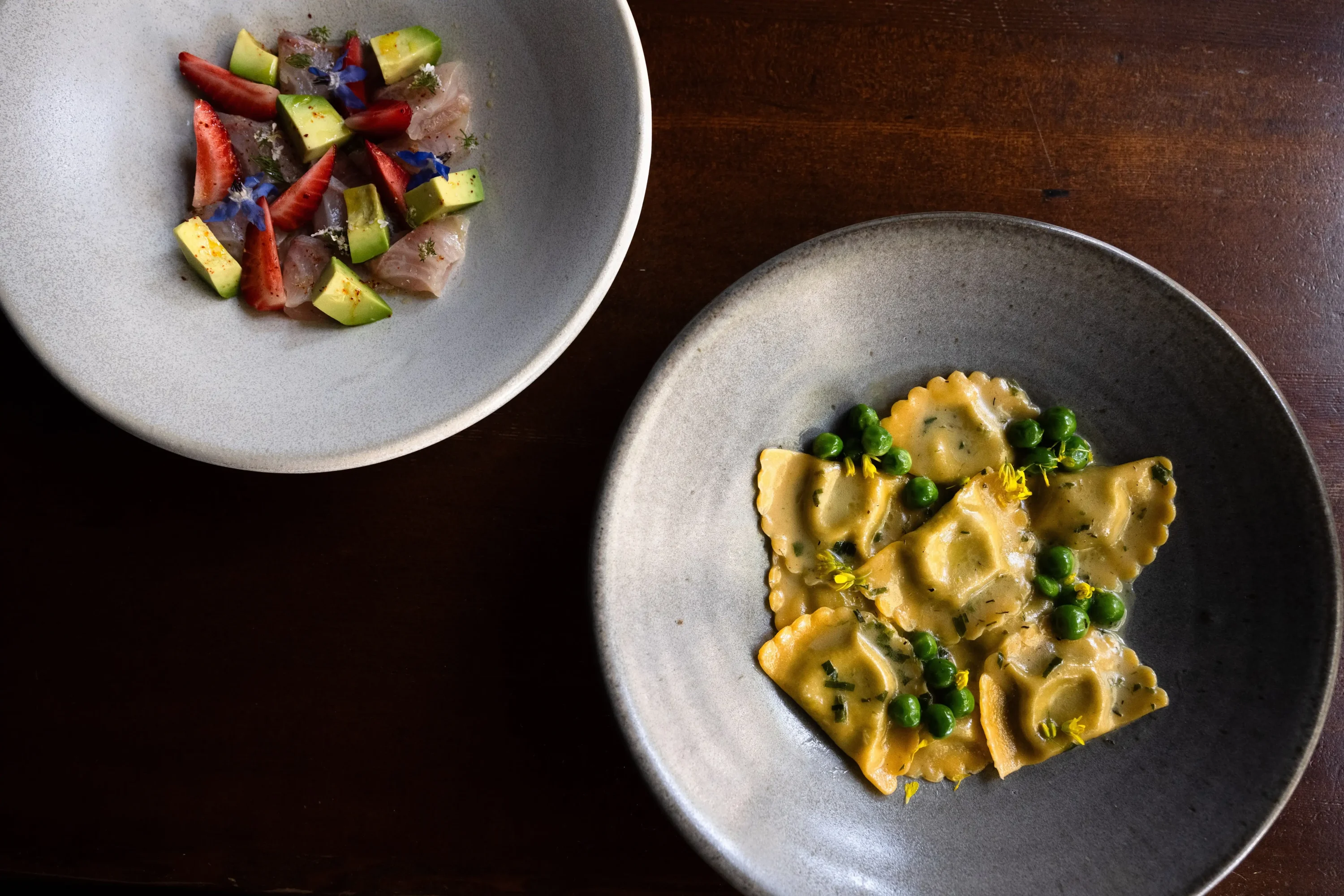 Plates of crudo and pasta at Seven Hills in SF.