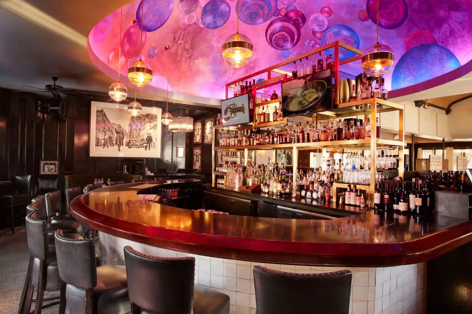 A colorful glass-art-inspired painting on the ceiling at the Al Biernat’s bar in Oak Lawn, Dallas. Book on OpenTable.