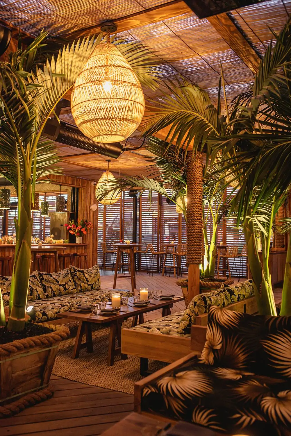 Indoor palms and a bamboo ceiling characterize the laid-back, tropical vibe of Belles Beach House. Relaxing couches and bamboo chandeliers enhance the vibe at this OpenTable restaurant in Venice Beach, Los Angeles.