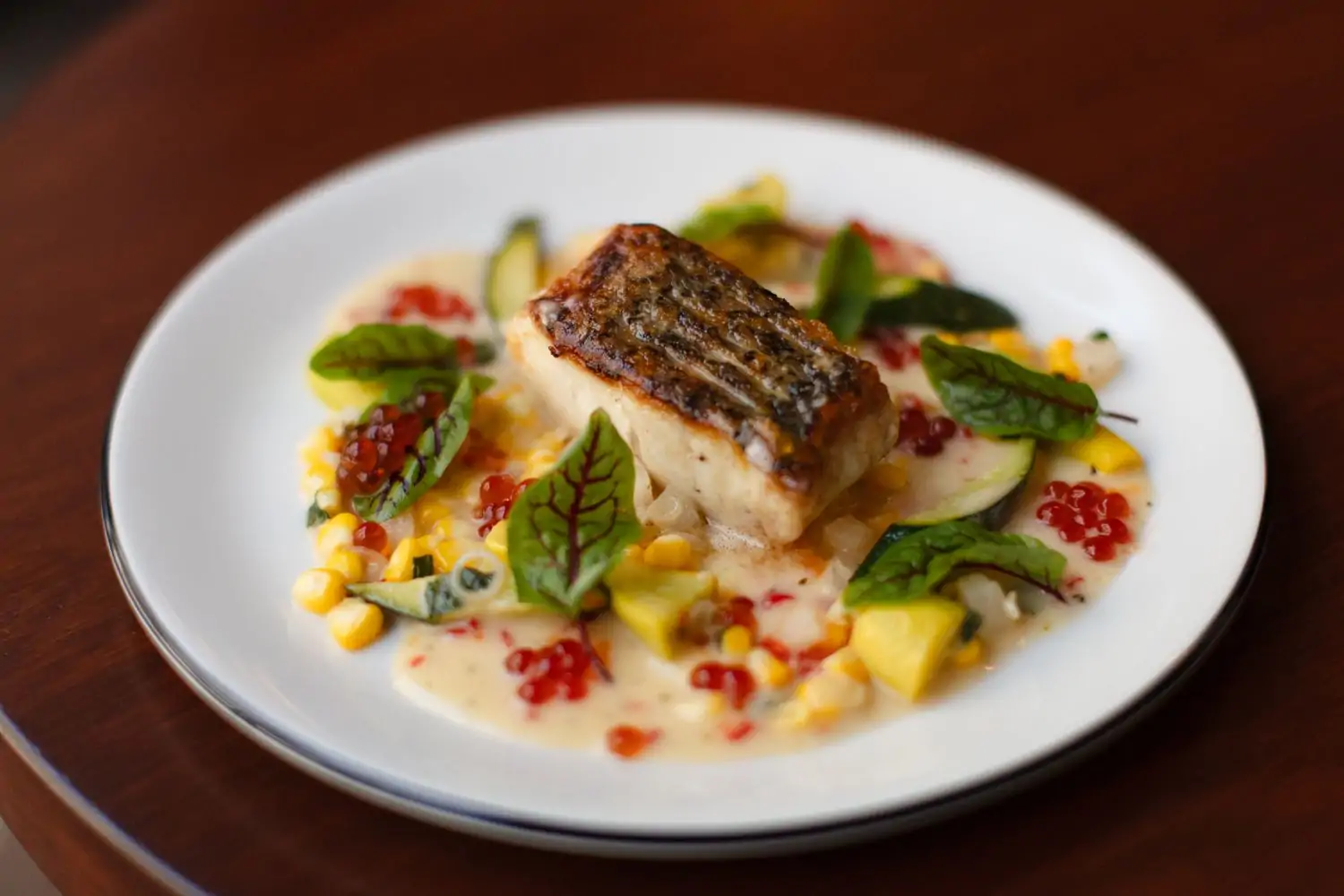 An elegantly plated fish dish at Los Angeles restaurant Camélia
