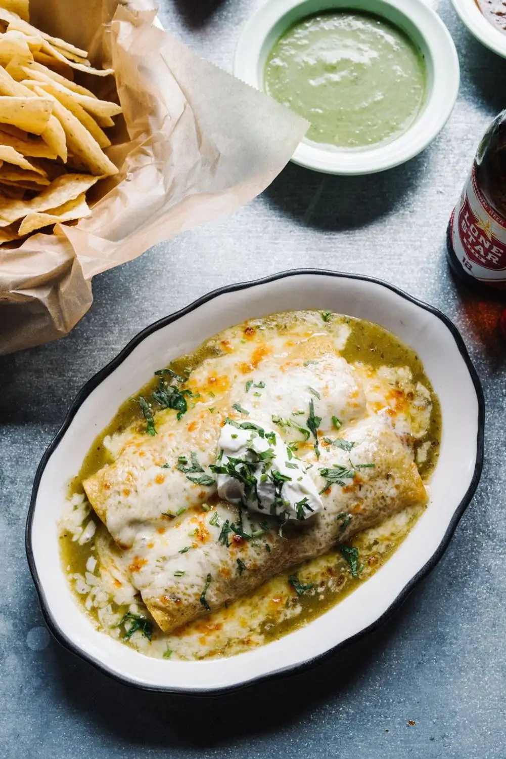 A plate of enchiladas covered in queso fresco at Superica, one of Houston’s best Mexican restaurants on OpenTable.