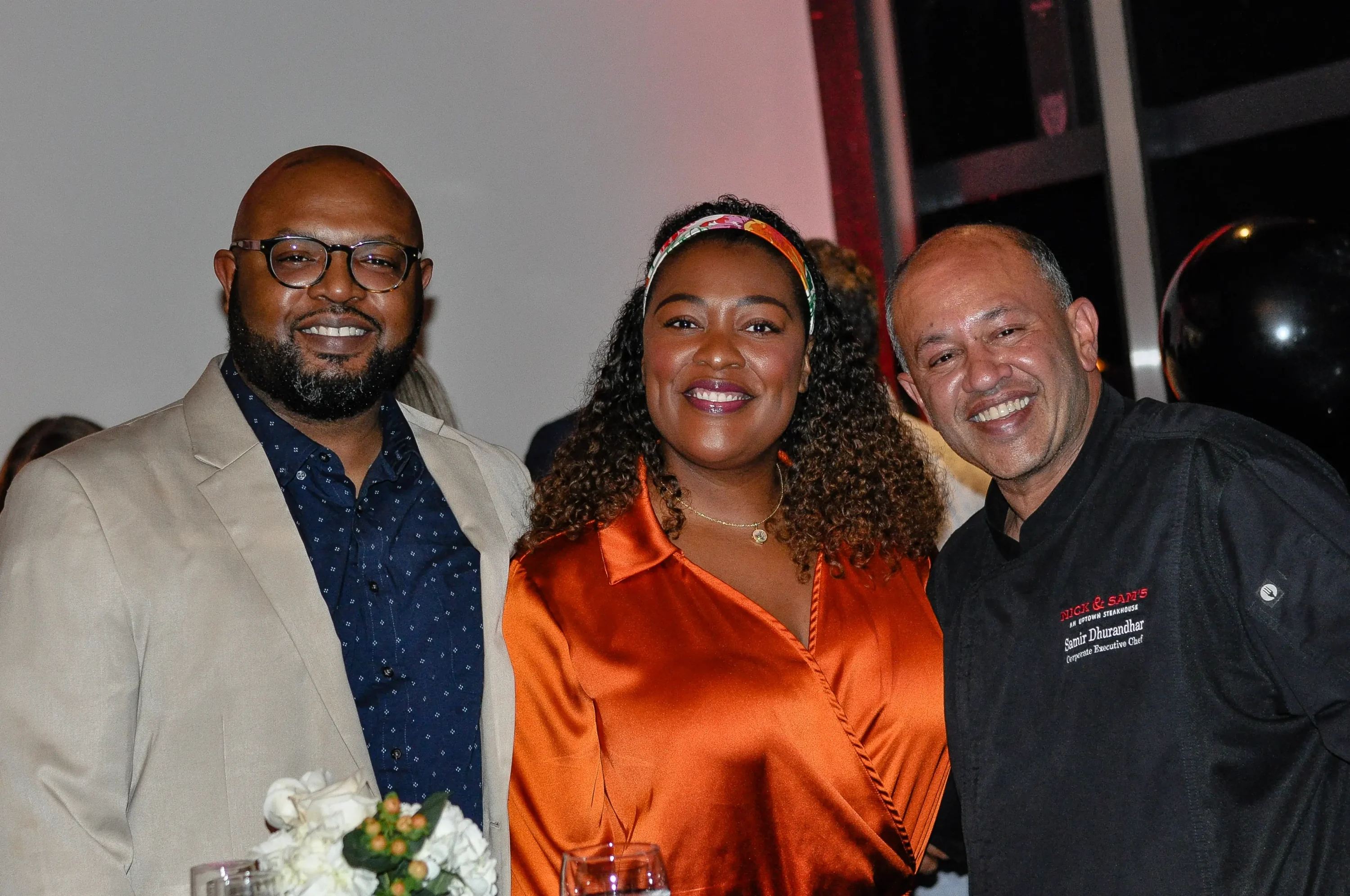 Chef Tiffany Derry (center), owner of Roots Southern Table in Dallas, available on OpenTable.