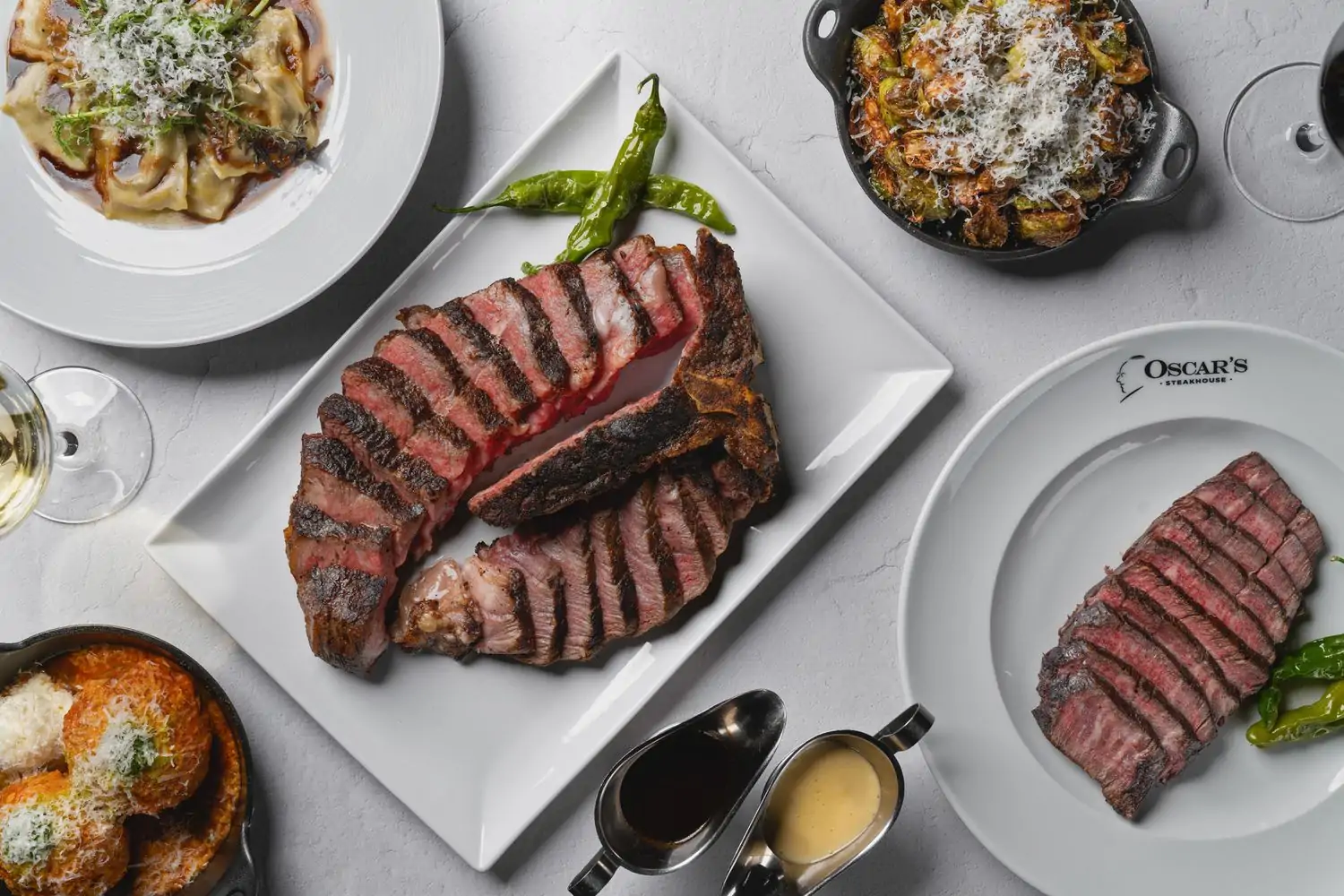 Plates containing sliced steak at Oscar’s Steakhouse at the Plaza Hotel & Casino, one of the best restaurants near Fremont Street, Las Vegas. Book on OpenTable.