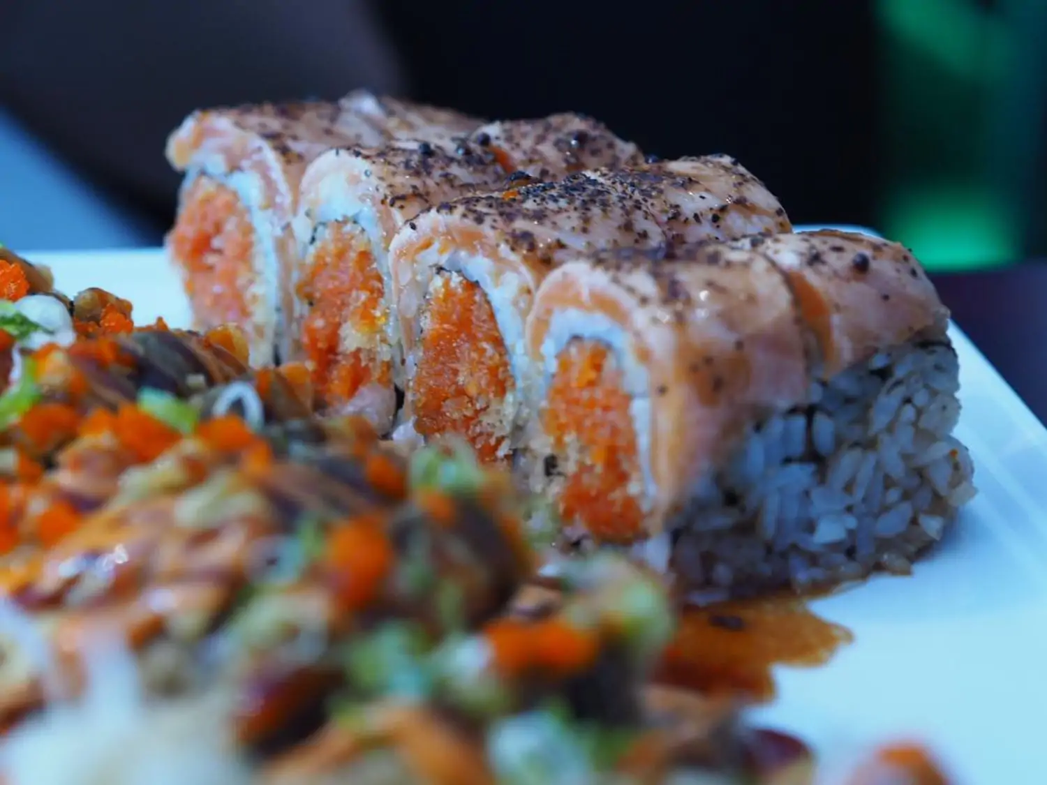 Large platter with various types of sashimi, including shrimp, tuna, and whitefish, garnished with roe, wasabi, and vegetables at Bleu Sushi, in Philadelphia. You can book on OpenTable.