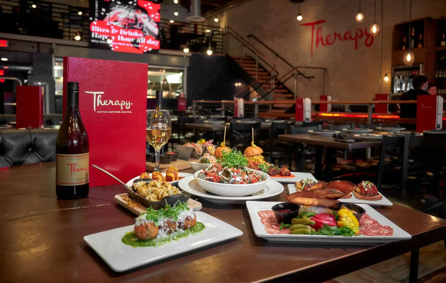 A table containing several shareable plates at Therapy, one of the best restaurants on Fremont Street Las Vegas, found on OpenTable.