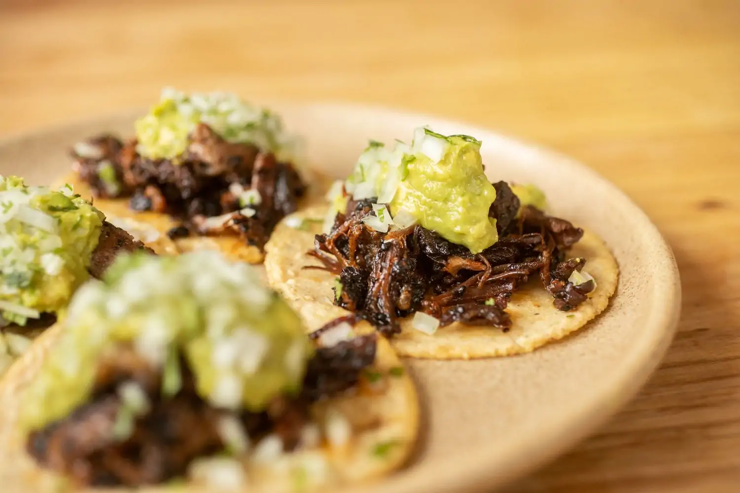A close-up of a suadero taco made with confit wagyu brisket on homemade masa at Suerte, in Austin. Book on OpenTable.
