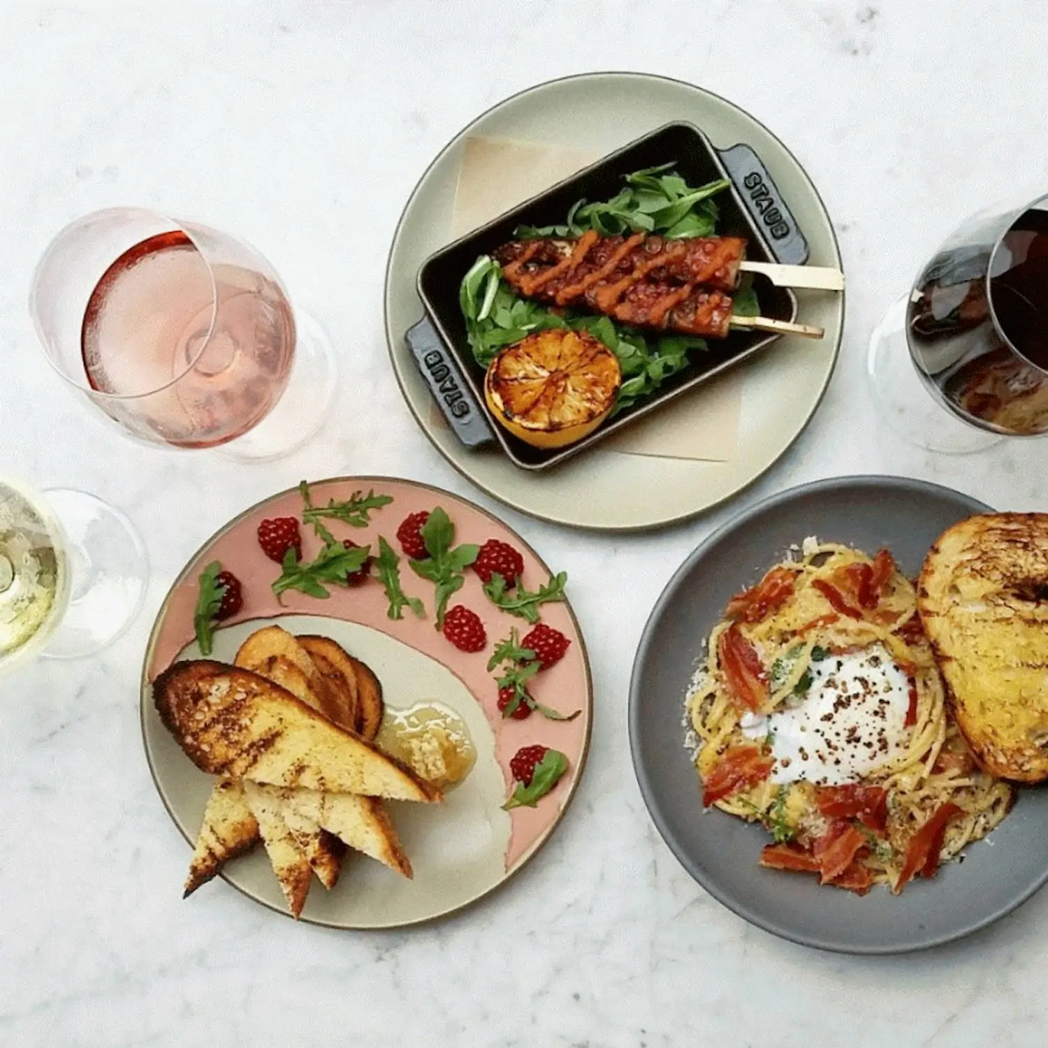 A variety of small plates and wines with artful plating at Tar & Roses in Santa Monica. Book on OpenTable.