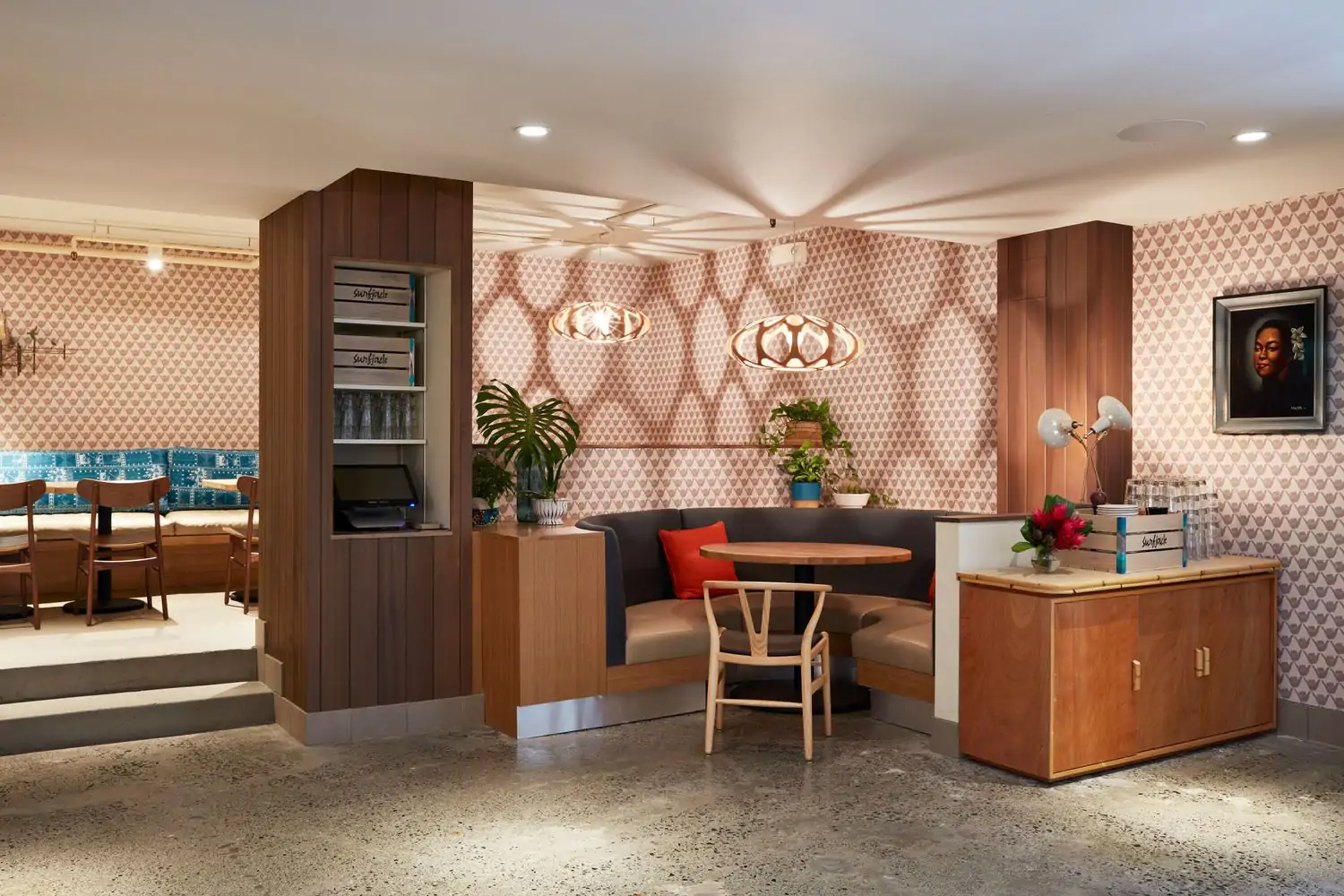 The retro-chic wallpapered dining room with cozy seating at Mahina and Sun's - Surjack Hotel, Honolulu. Book on OpenTable.