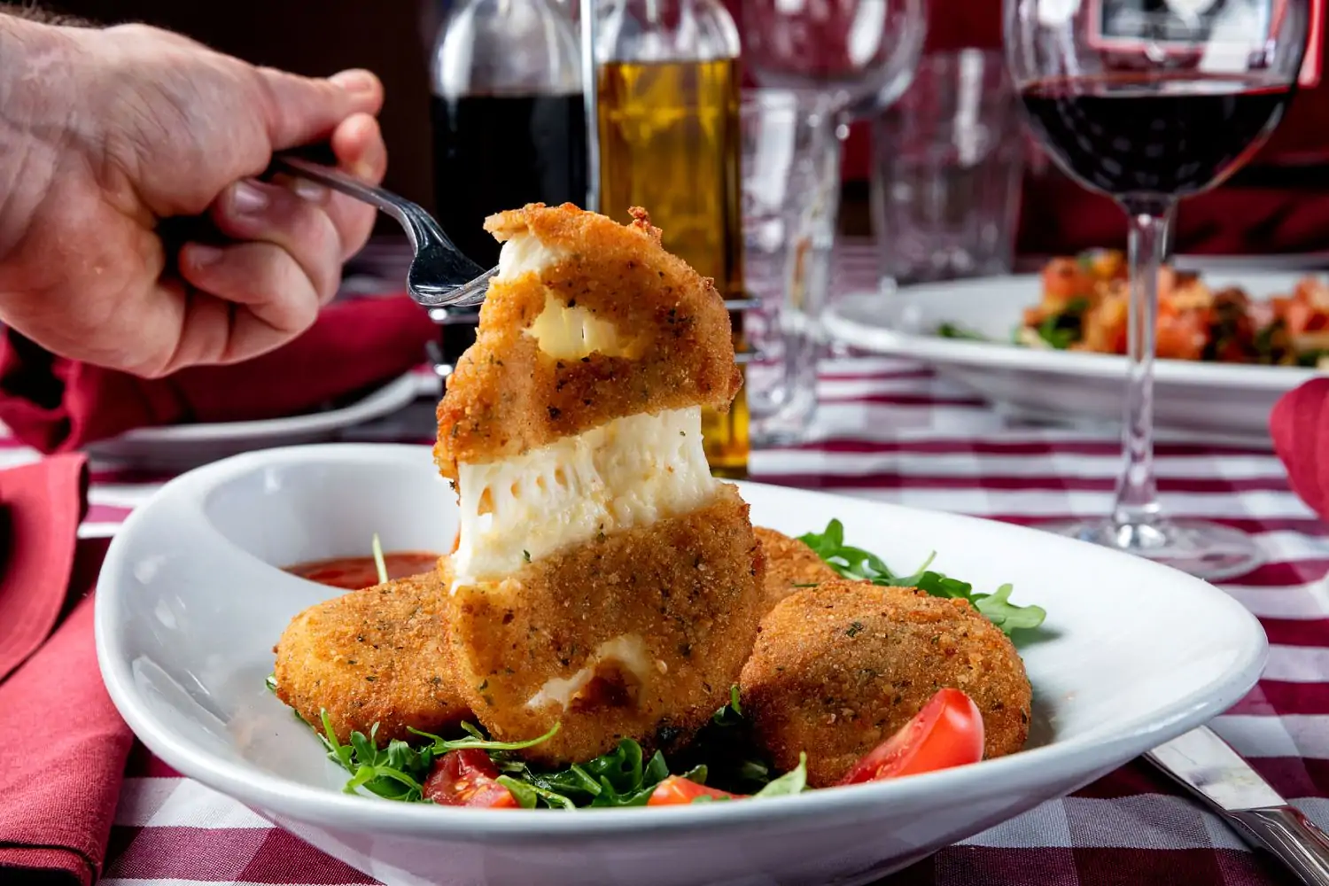 Mozzarella in carrozza on a white dish at Fratelli La Bufala, one of the best family friendly restaurants in Miami. Book on OpenTable.