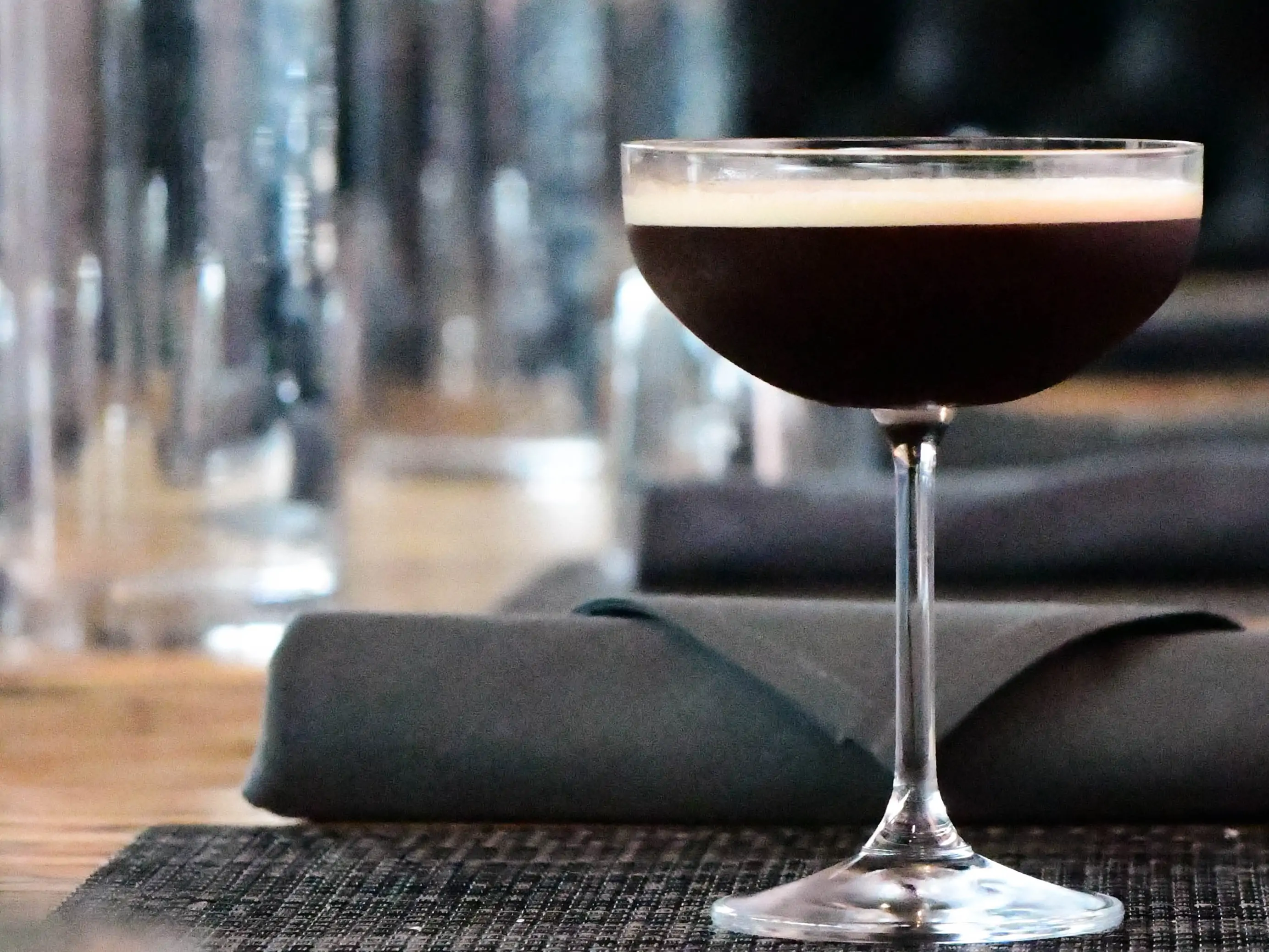 An espresso martini on a bar counter at Portland restaurant Bistecca Wood Fire Steakhouse