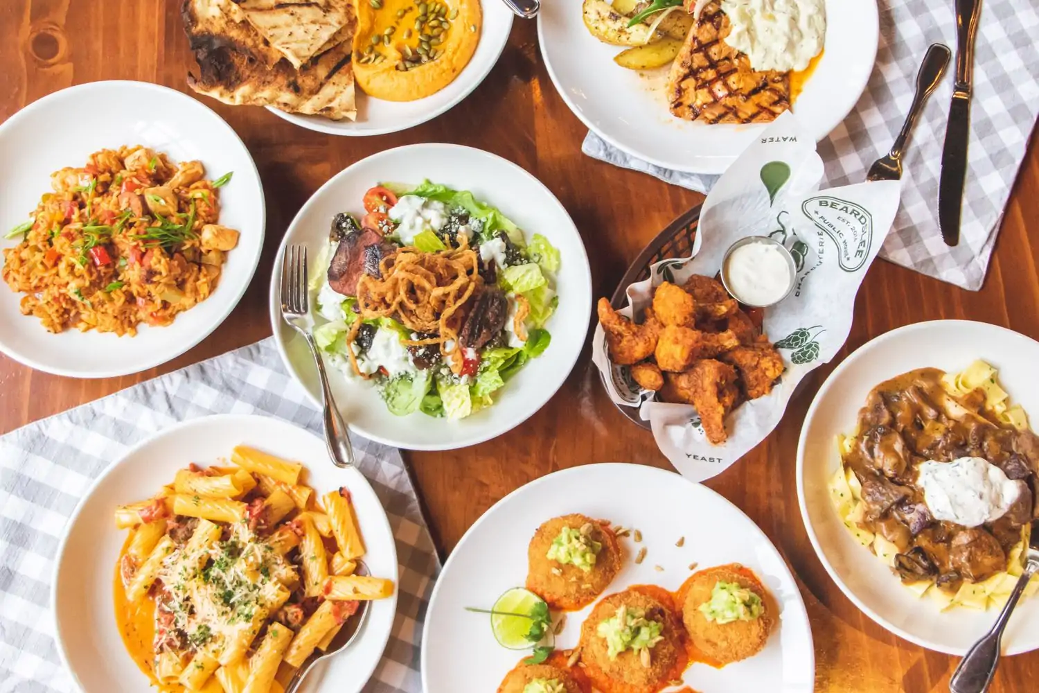 A table setting with American-inspired plates at Beardslee Public House, one of the best family restaurants in Seattle, found on OpenTable.