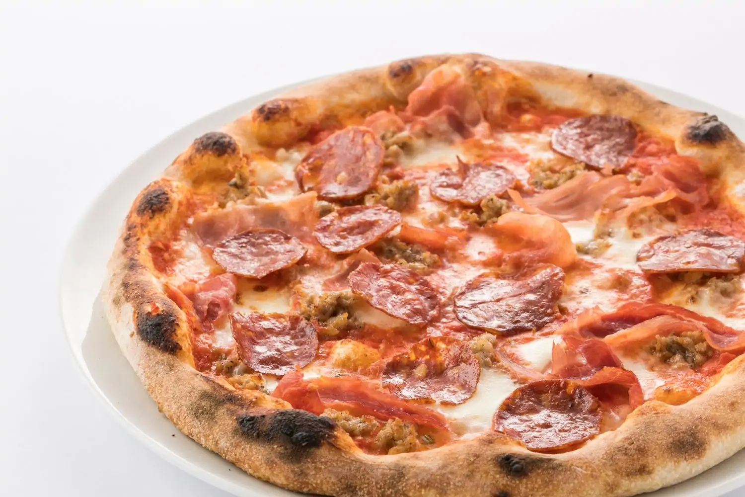 A pepperoni and sausage pizza is on the menu at Arancino Beachwalk, one of the top family restaurants in Honolulu. Book on OpenTable.