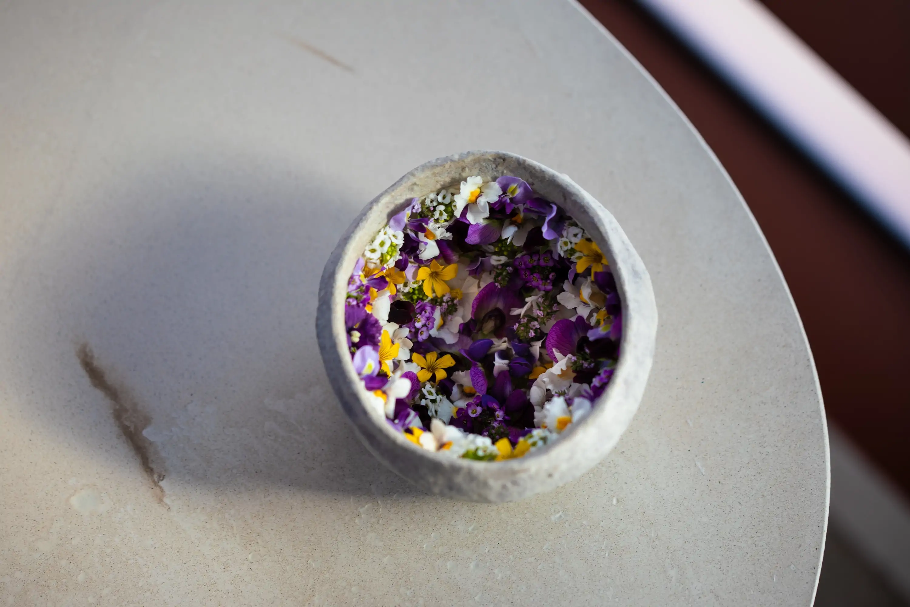 A dish made up of edible flowers at Los Angeles restaurant Vespertine