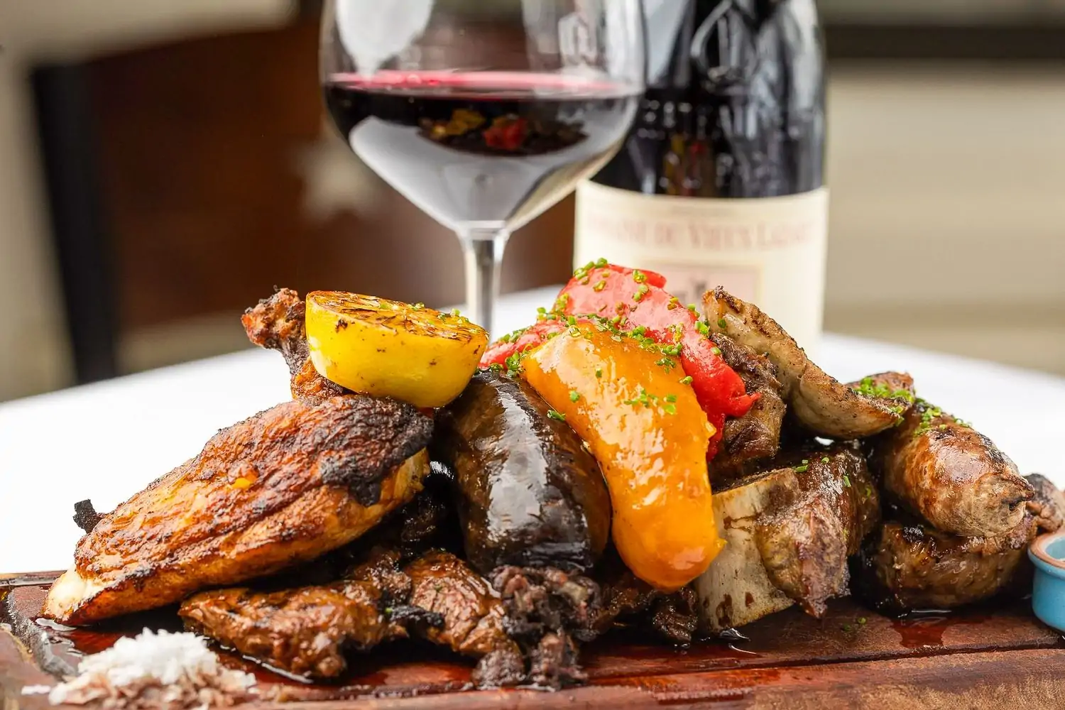 A plate of parrillada with grilled steak, chicken, and sausage at Palermo Argentinian Bistro, New York City, on OpenTable.