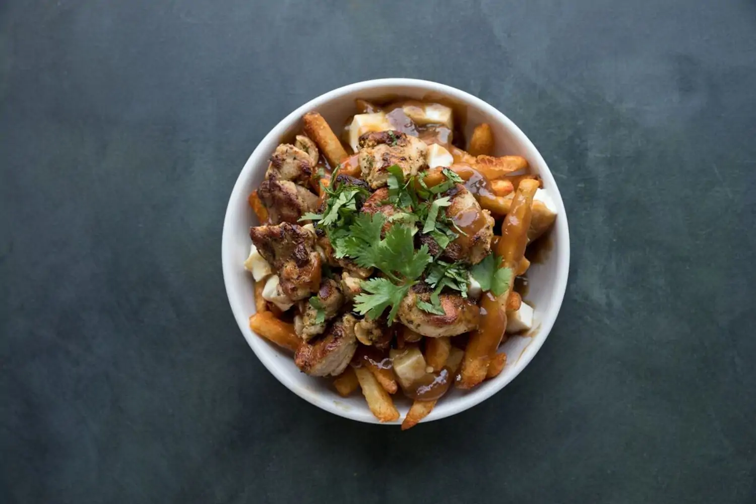A chicken and French fries dish at Los Angeles restaurant Badmaash