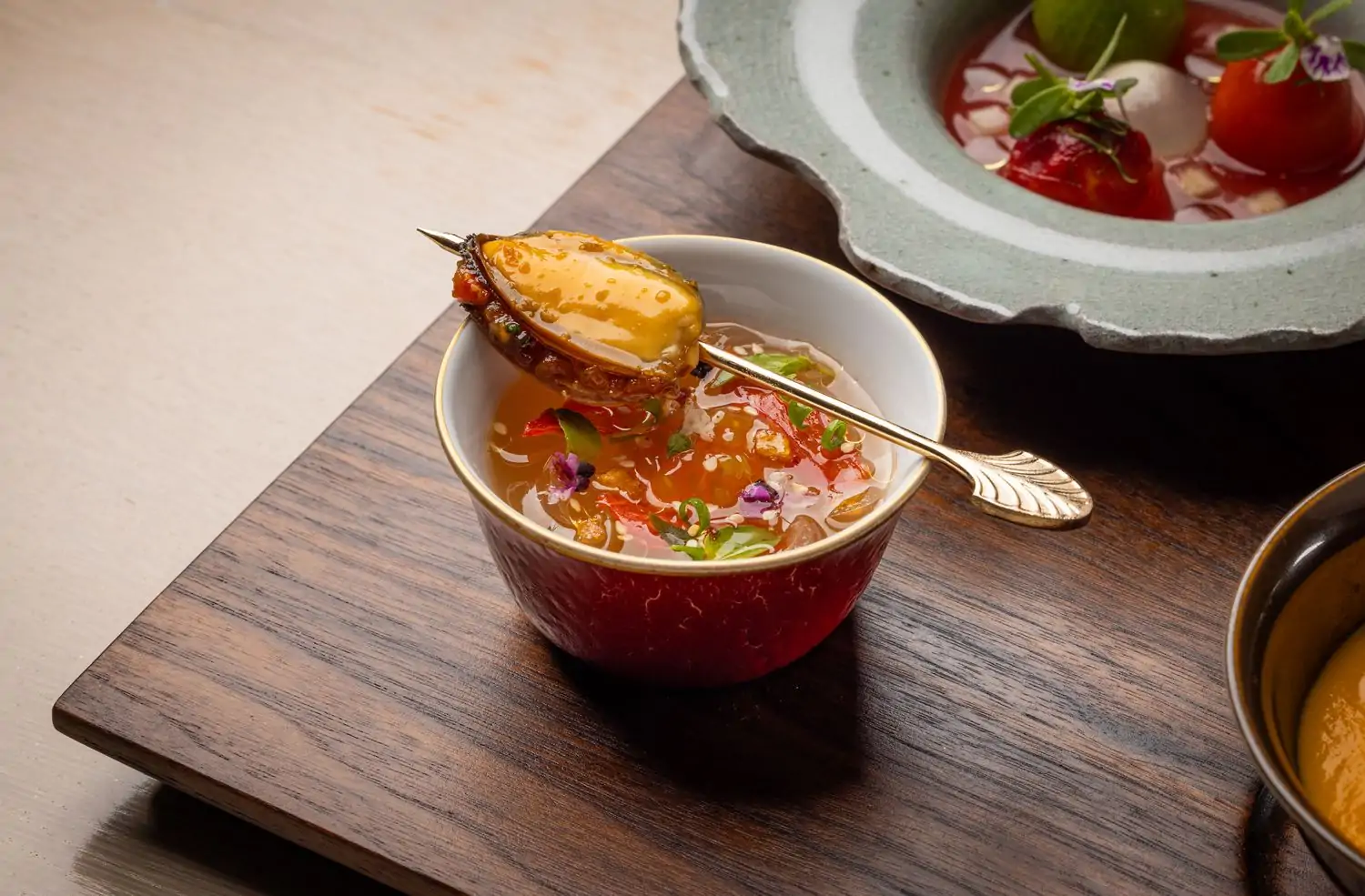 A mussel and tomato consommé dish at Los Angeles restaurant Mélisse