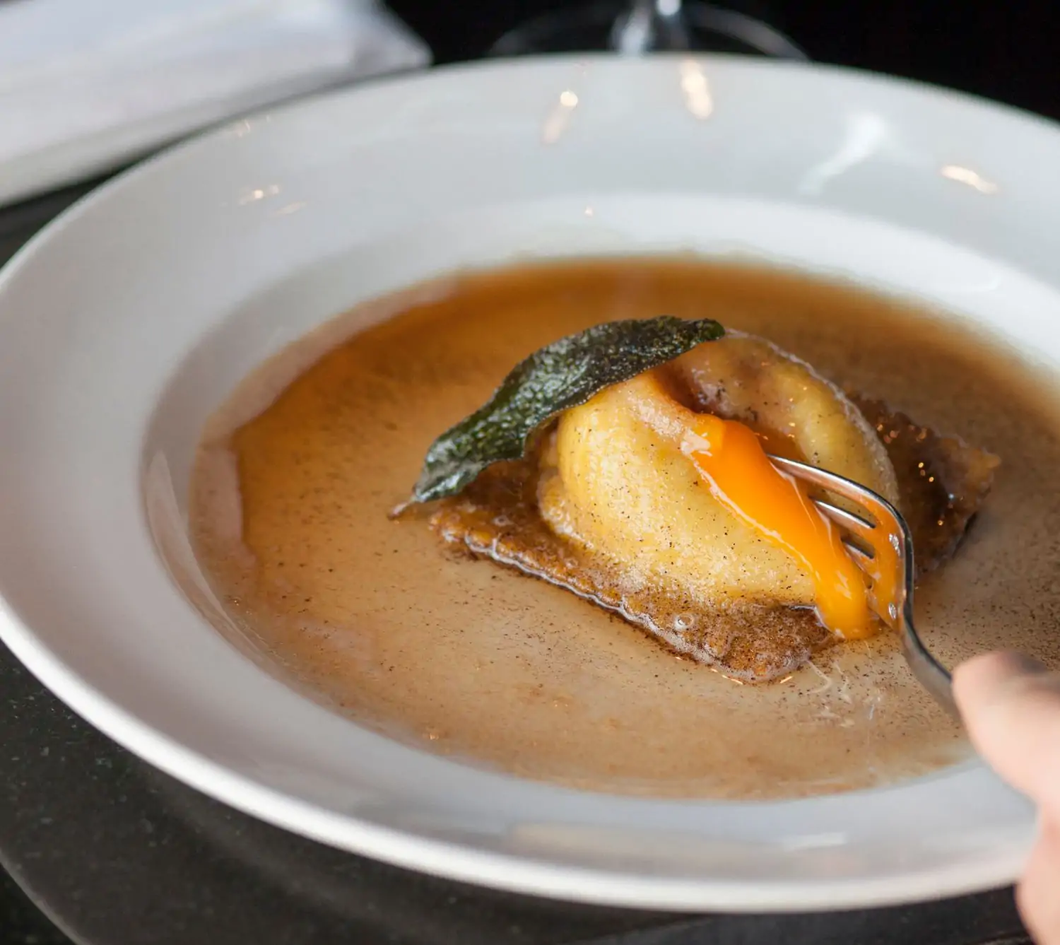 A raviolo filled with egg at Los Angeles restaurant Osteria Mozza