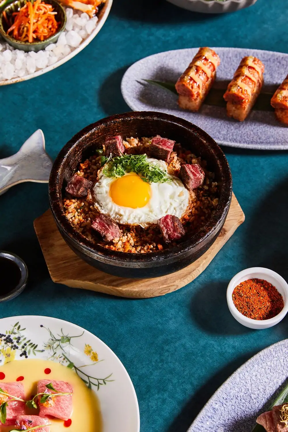 A birds-eye view of shareable appetizers and seafood dishes at Catch LA in West Hollywood, available on OpenTable.