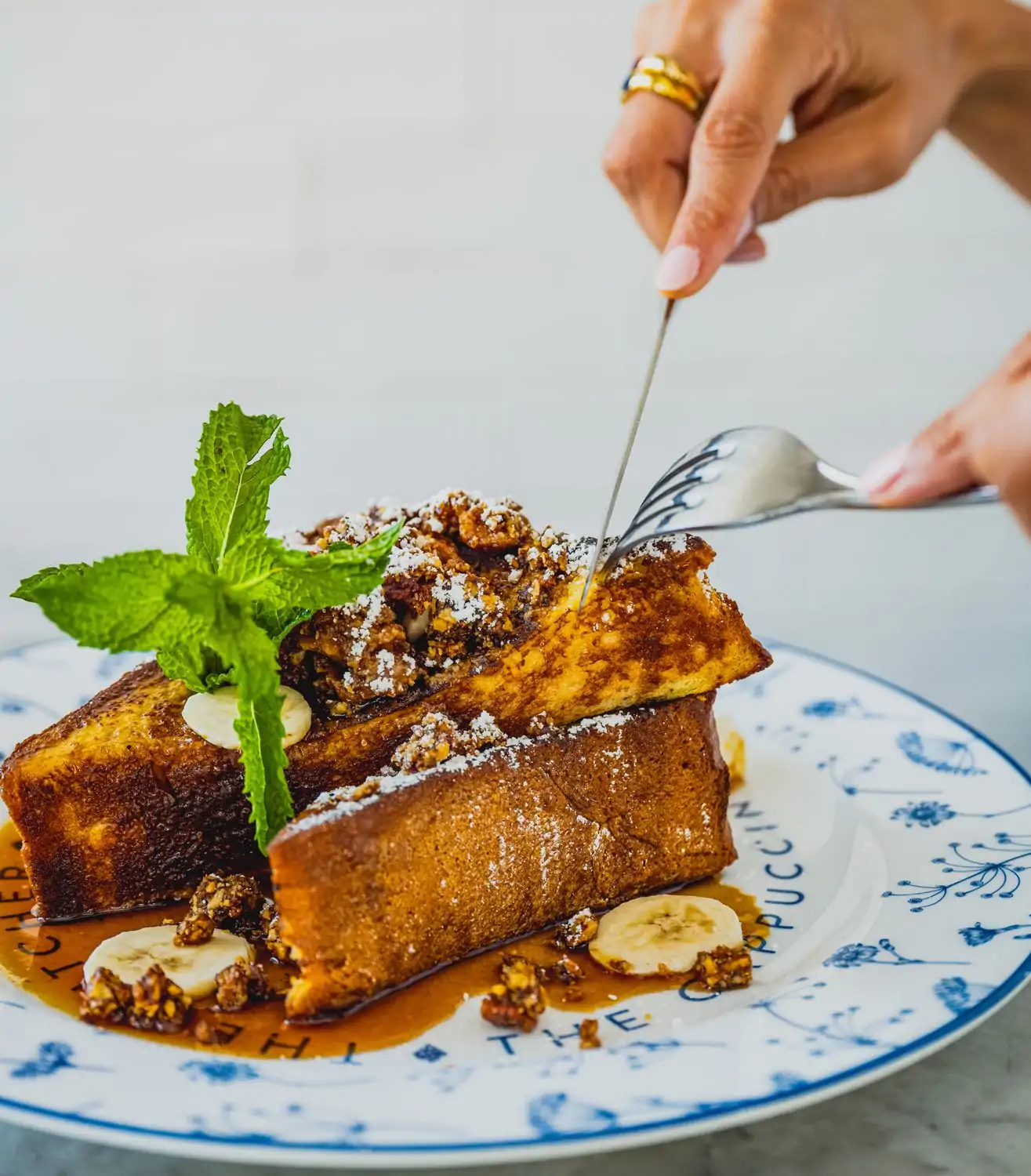 A portion of bananas foster French toast at The Butcher, The Baker, The Cappuccino Maker, in West Hollywood. Book on OpenTable.